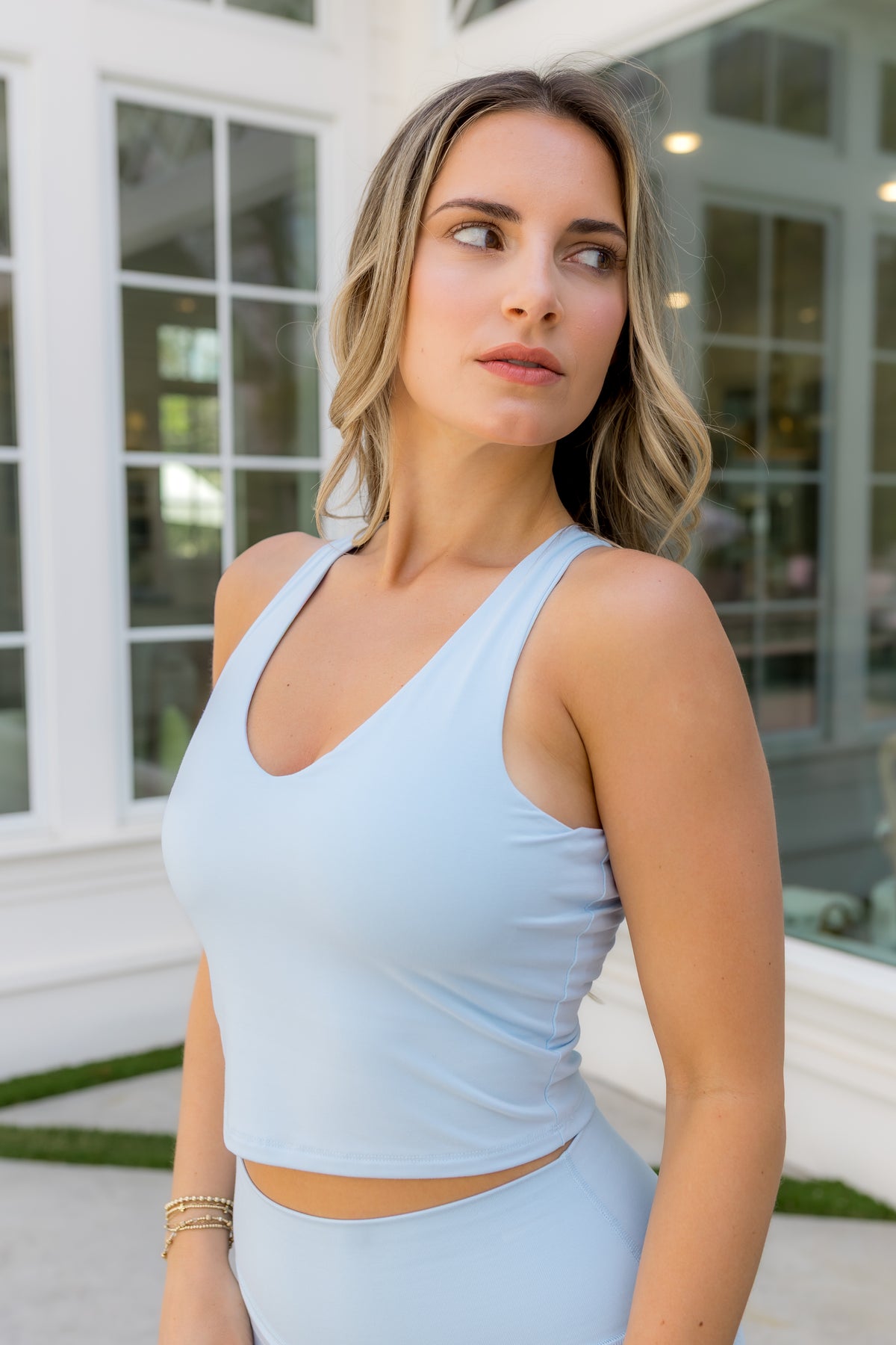 Female modeling the Bamboo Flex Bra Tank in Breeze with matching skort