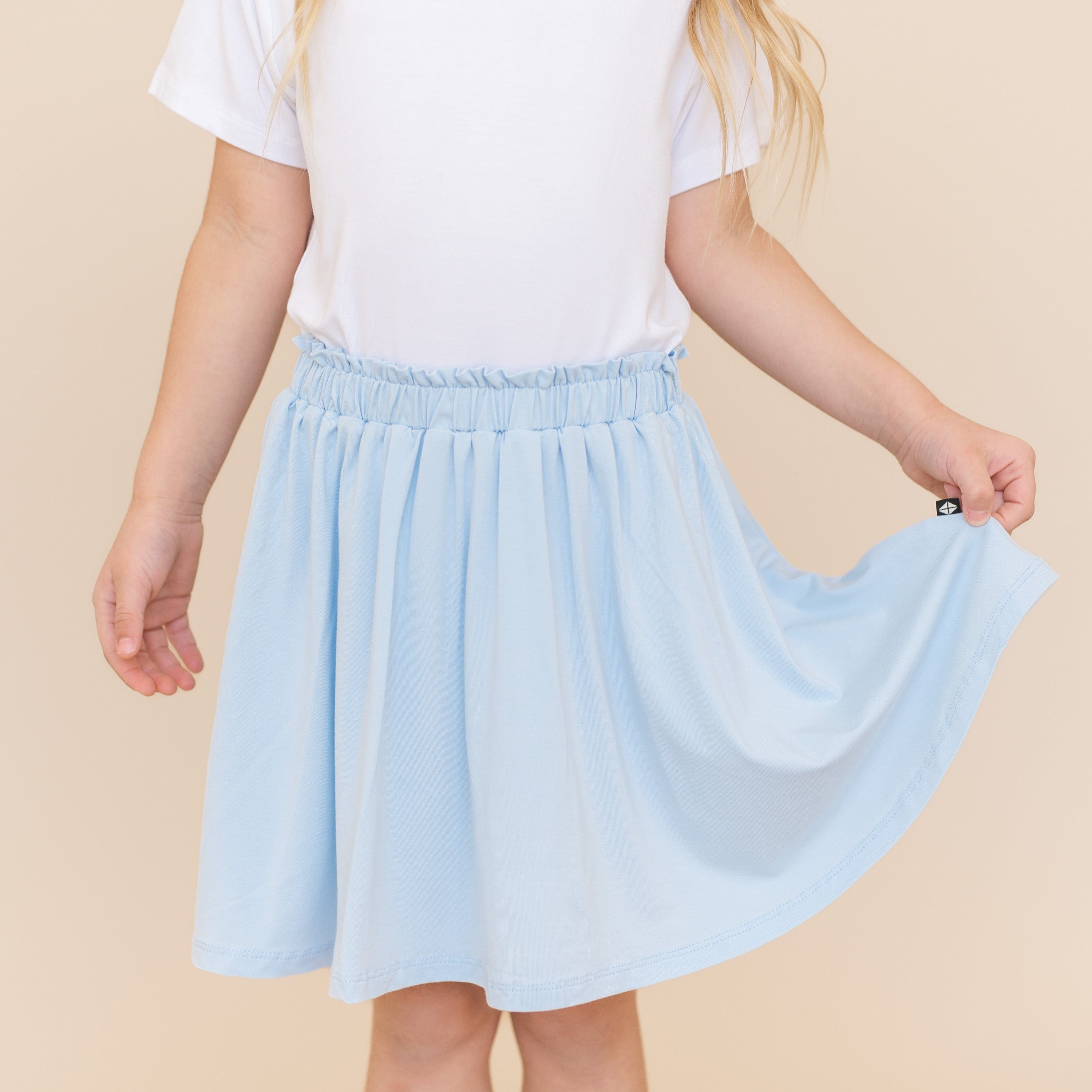 Close up of the Toddler Skort in Breeze shown on a young female model