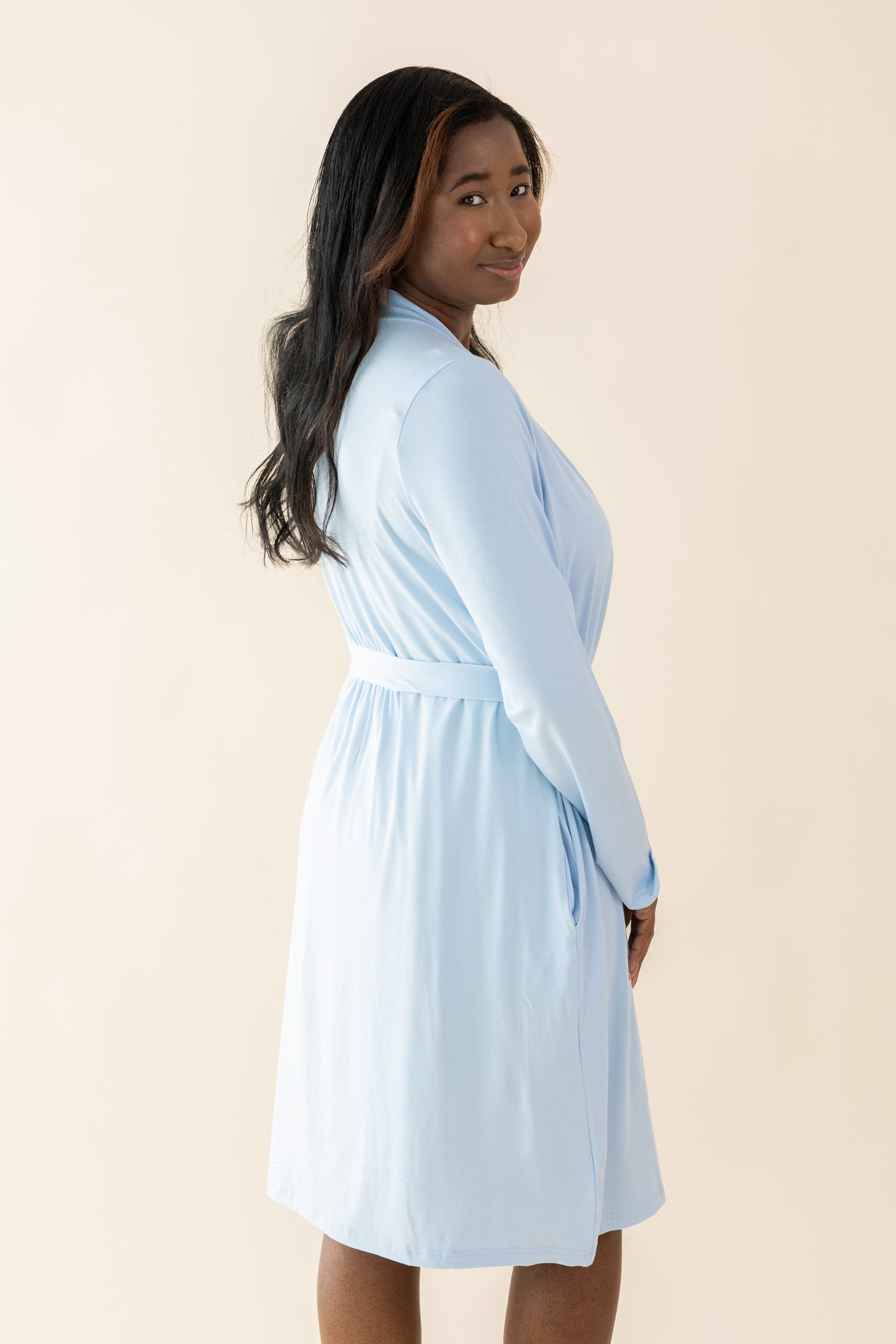 Female modeling the back of the Women's Lounge Robe in Breeze