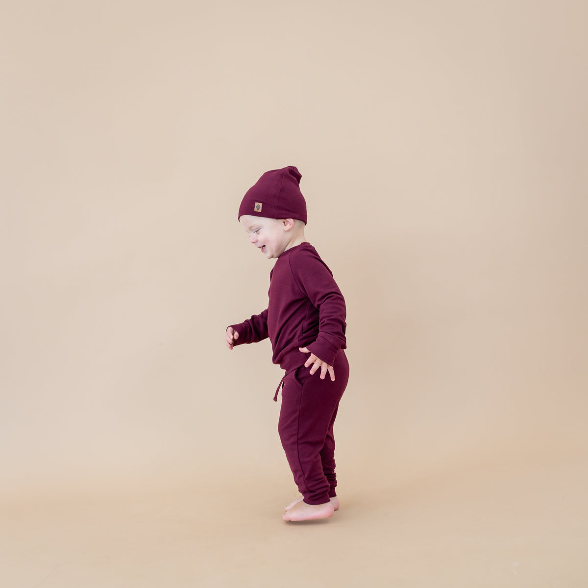 Toddler wearing Bamboo Jersey Beanie in Burgundy and matching jogger set