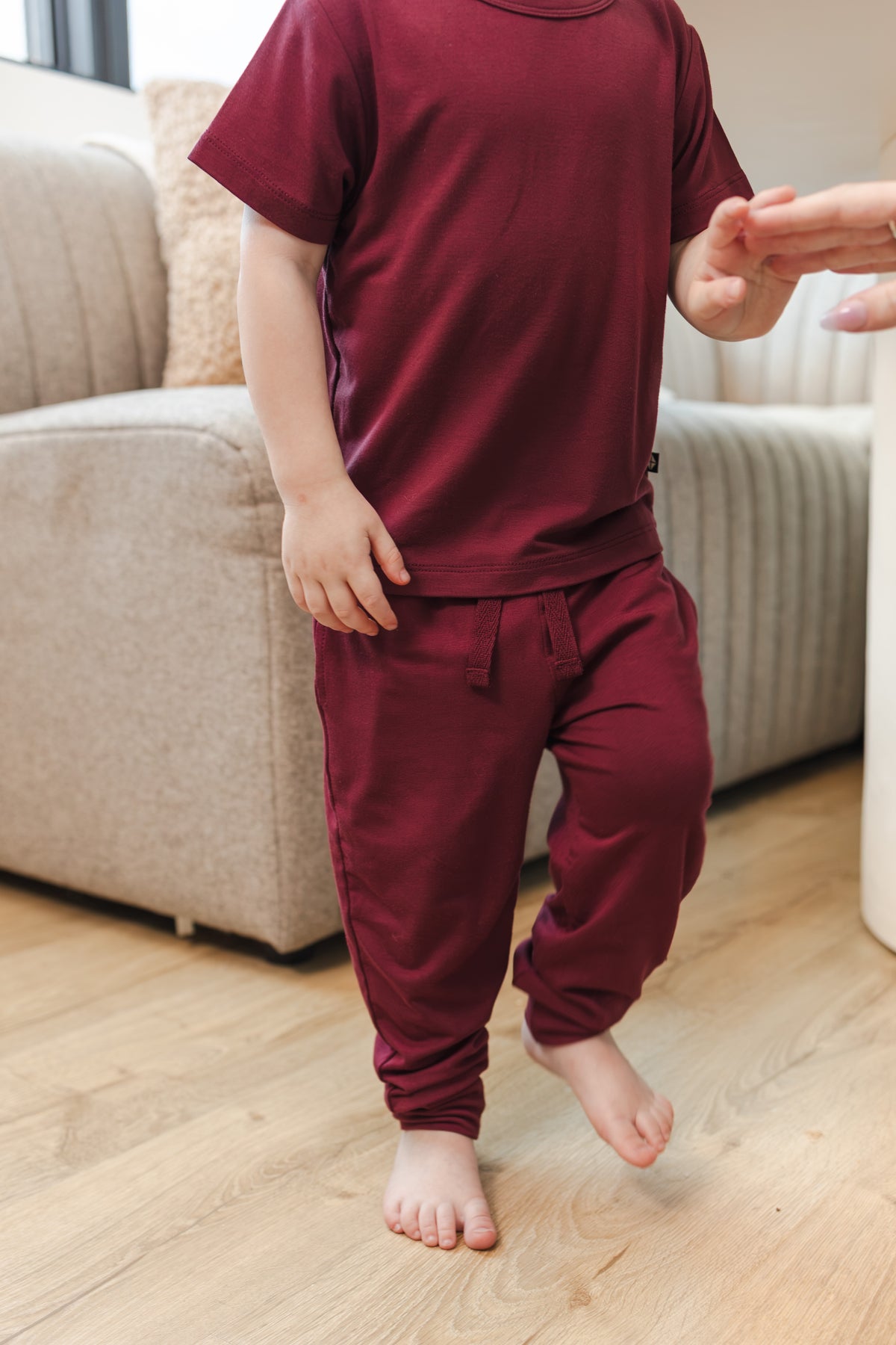 Child wearing Toddler Jogger Pant in Burgundy under Toddler basic tee in burgundy