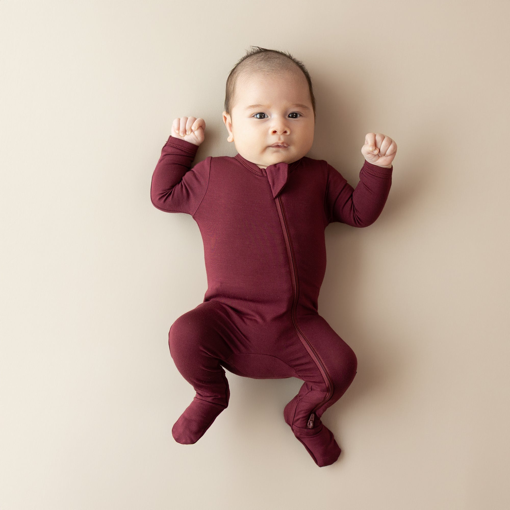 Baby wearing kids footie pajamas with zipper in Burgundy red