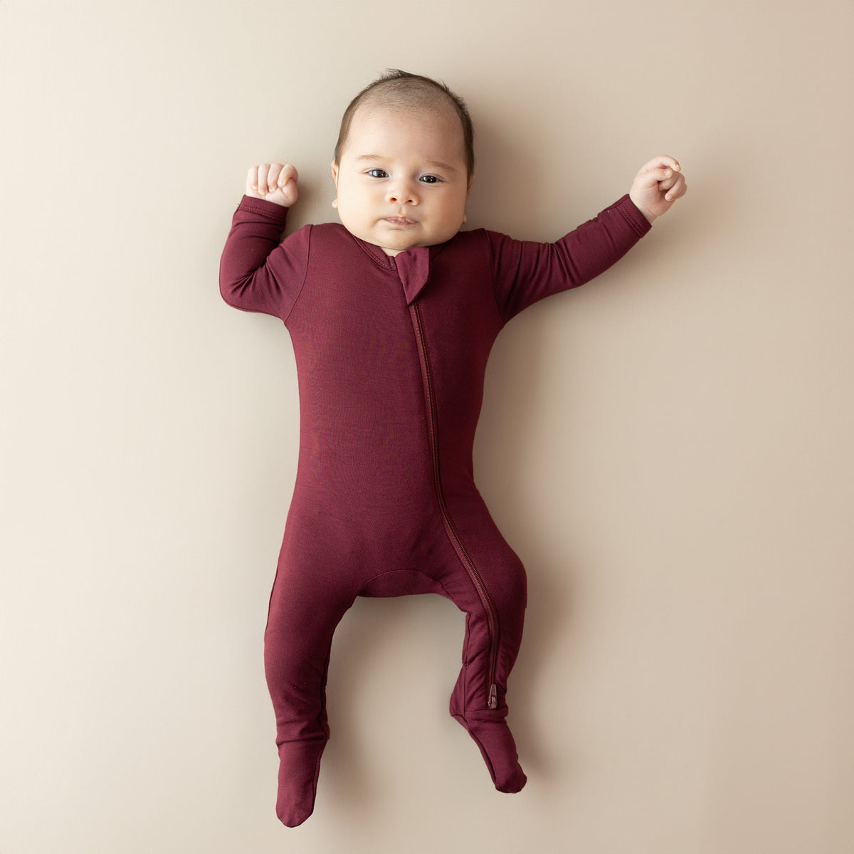 Newborn wearing Zippered Footie in Burgundy