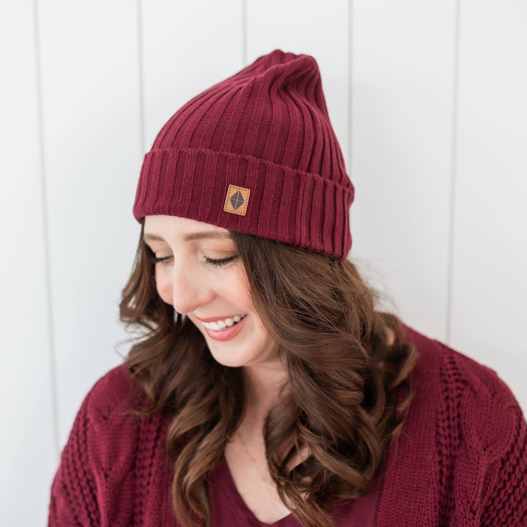 Chunky Knit Adult Ribbed Beanie in Burgundy shown on a female model