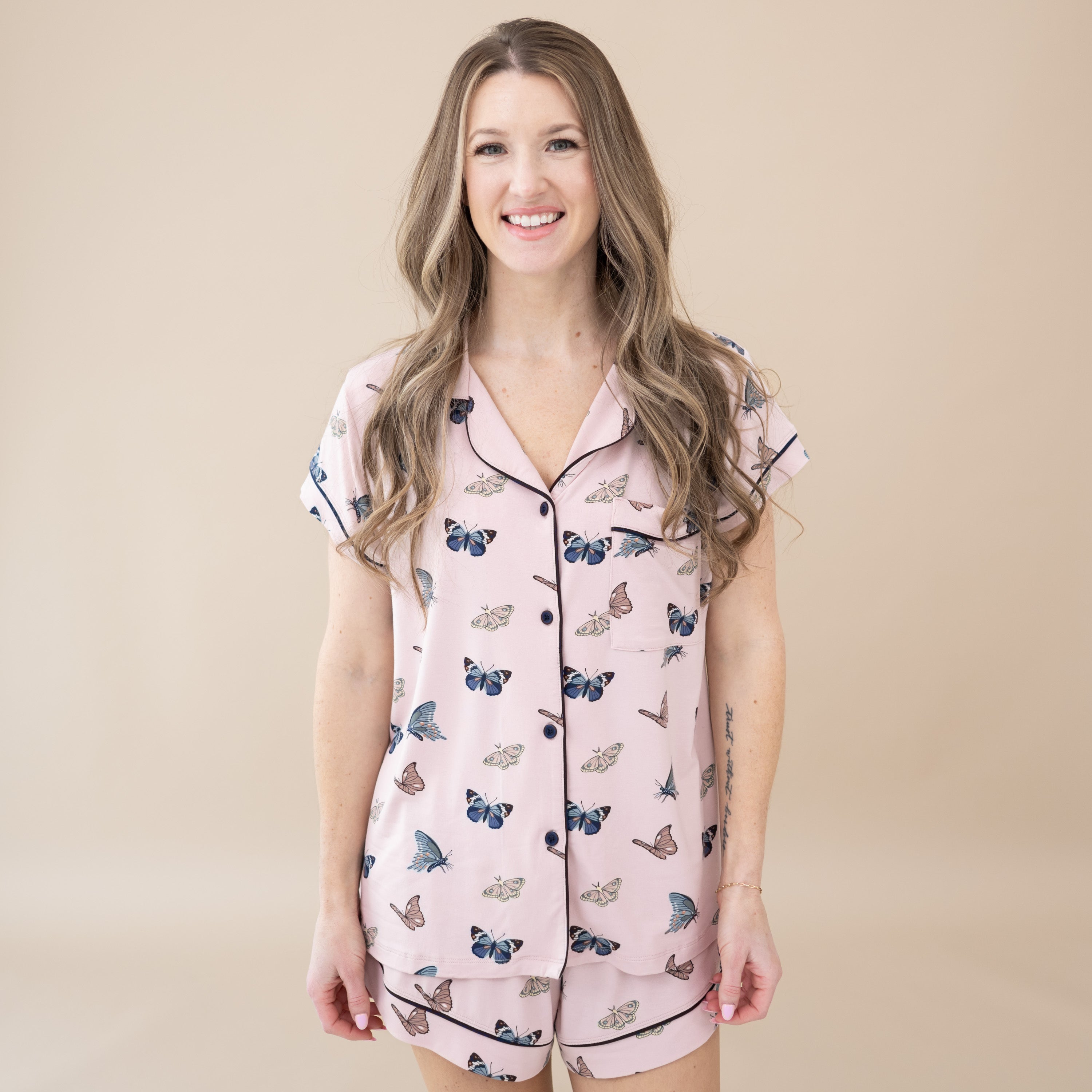 Model wearing Women’s Short Sleeve Pajama Set in Blush Butterfly