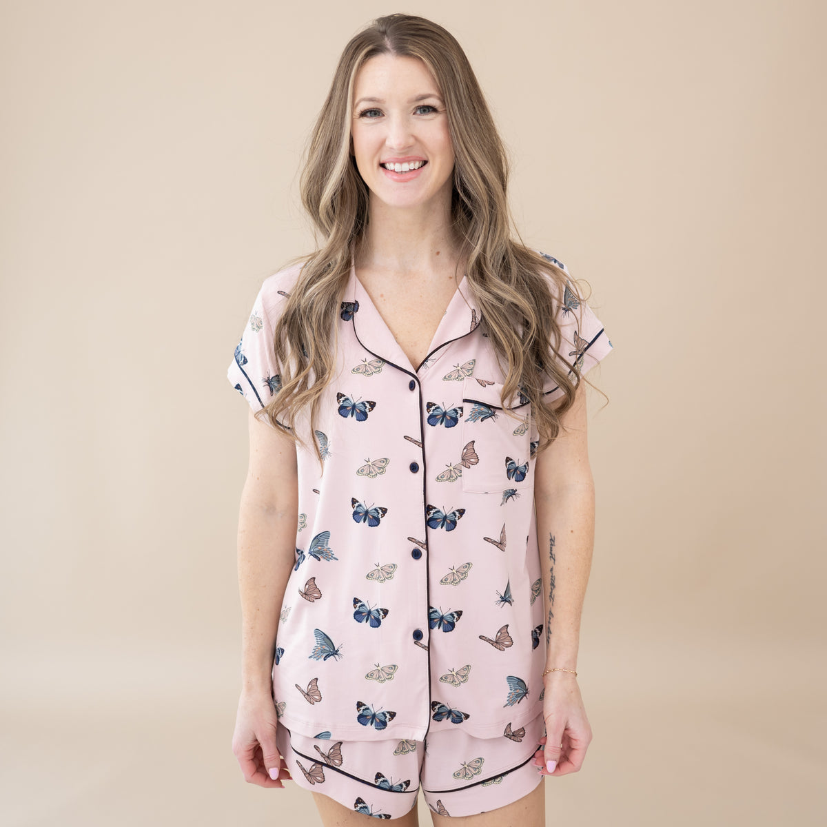 Model wearing Women’s Short Sleeve Pajama Set in Blush Butterfly
