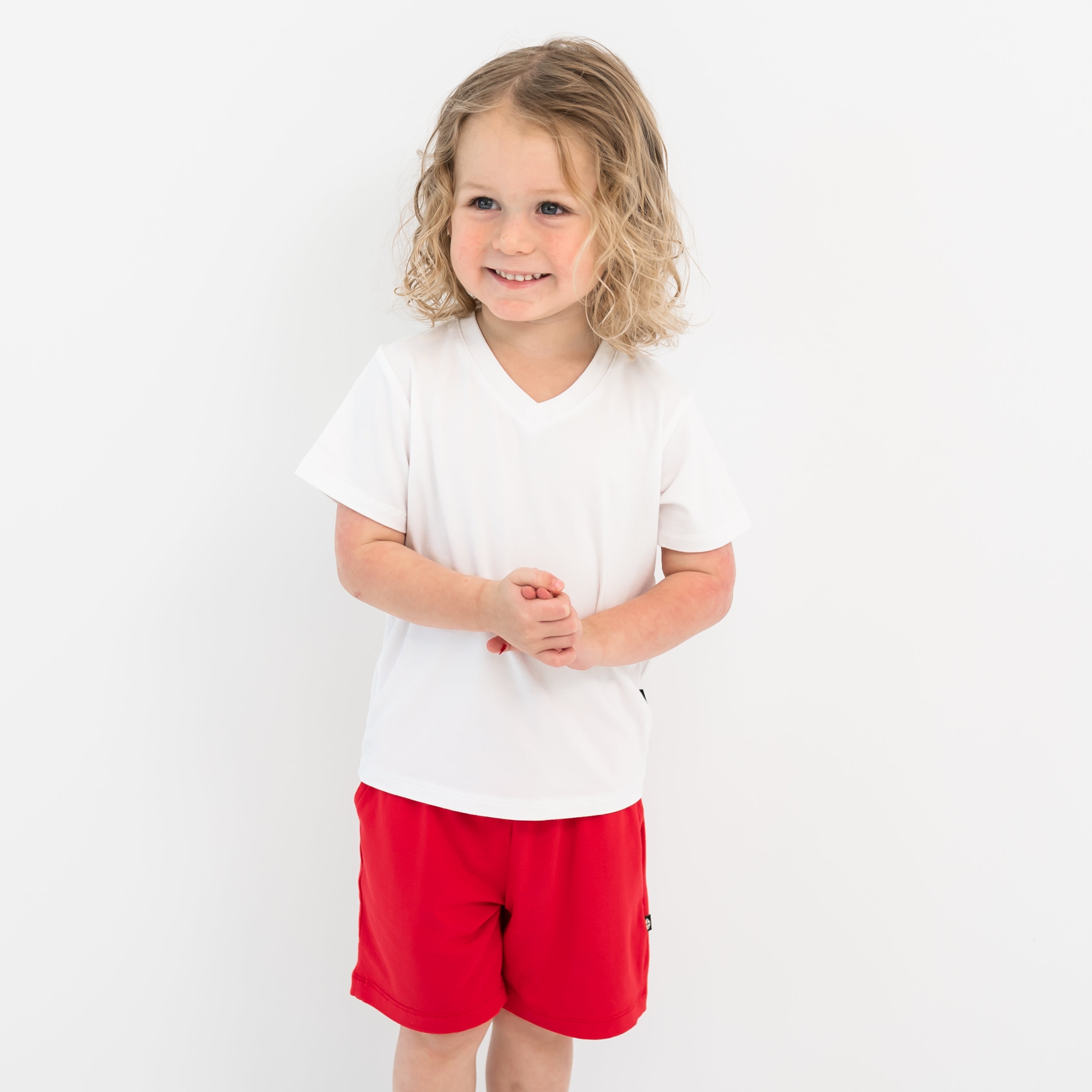 Toddler modeling Drawstring Short in Cardinal and Snow V-neck