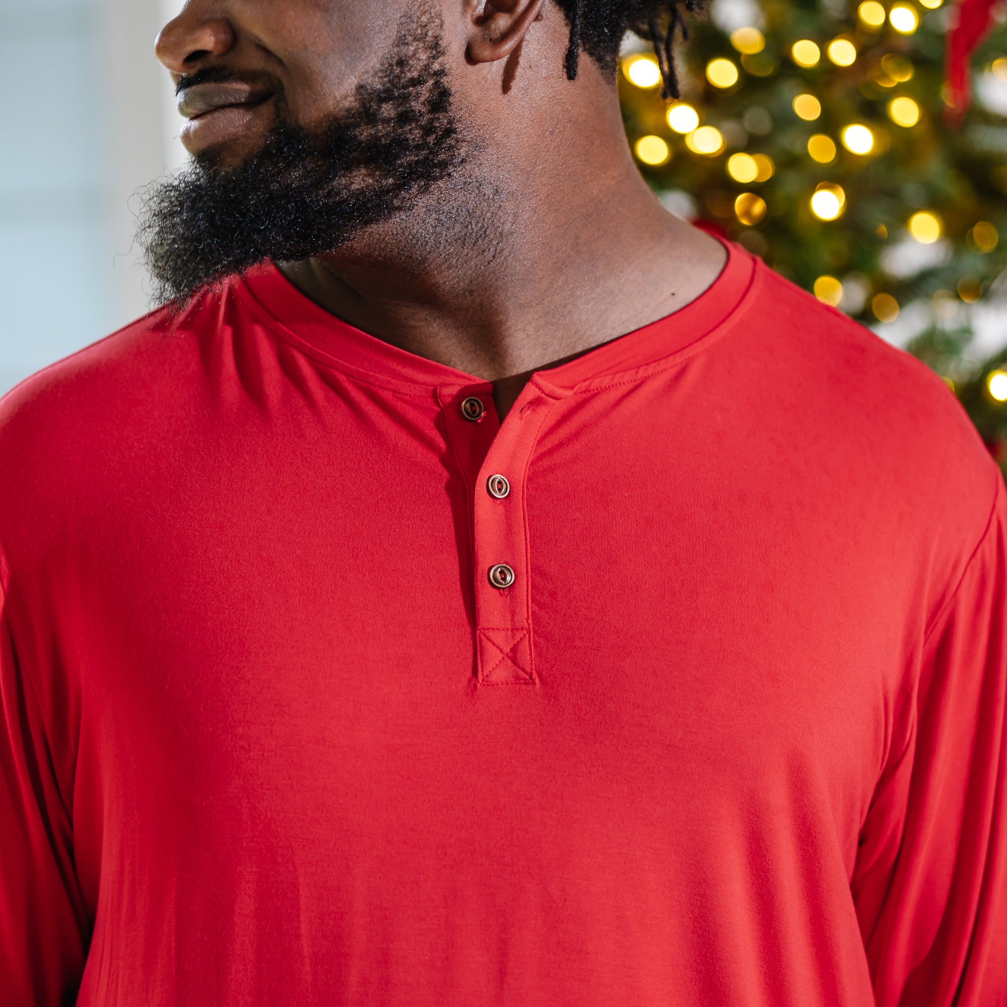 Close up of the button closures on the Men's Long Sleeve Henley Top in Cardinal