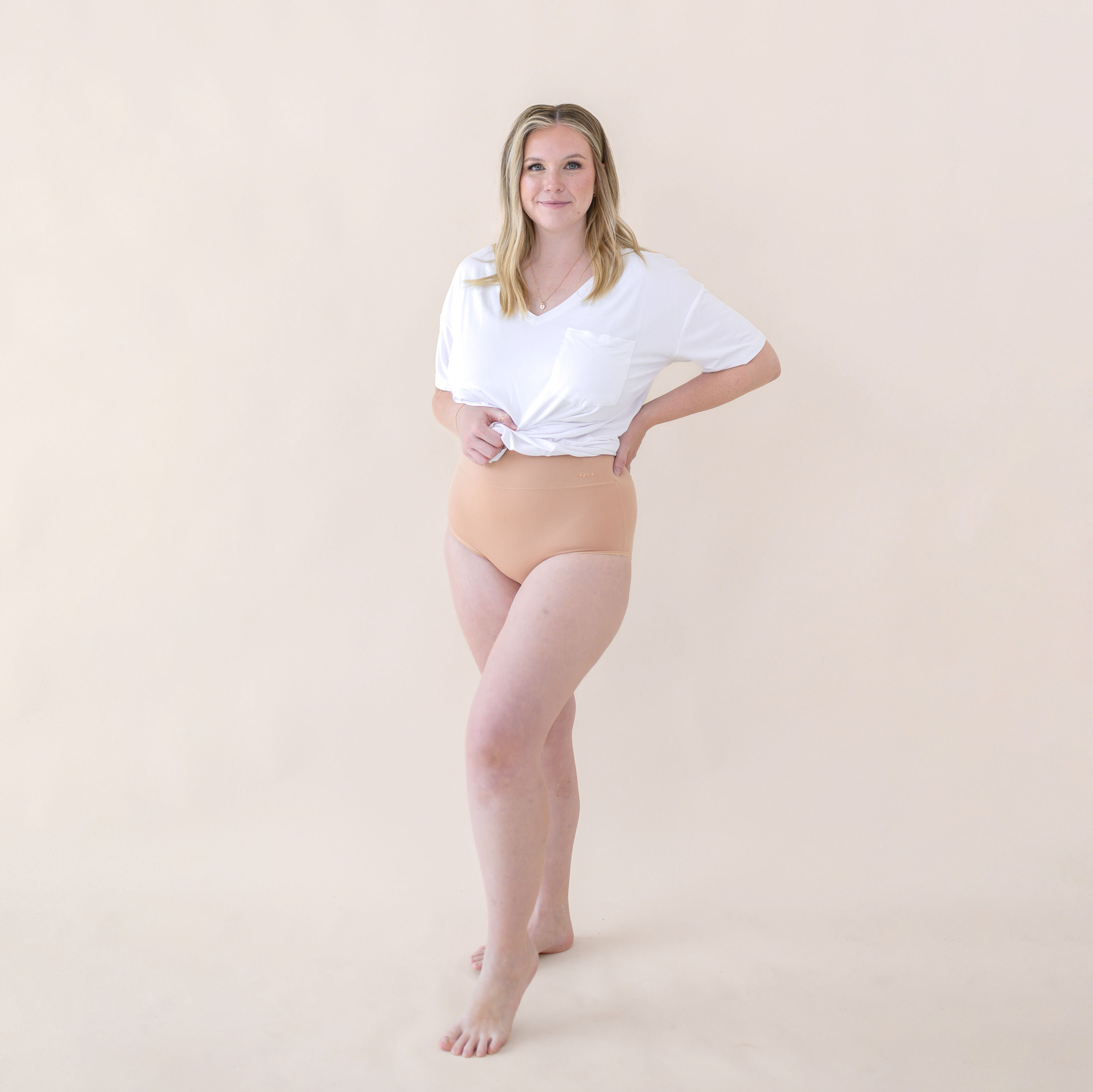 Woman modeling Women's High-Waisted Brief in Chai and snow v-neck