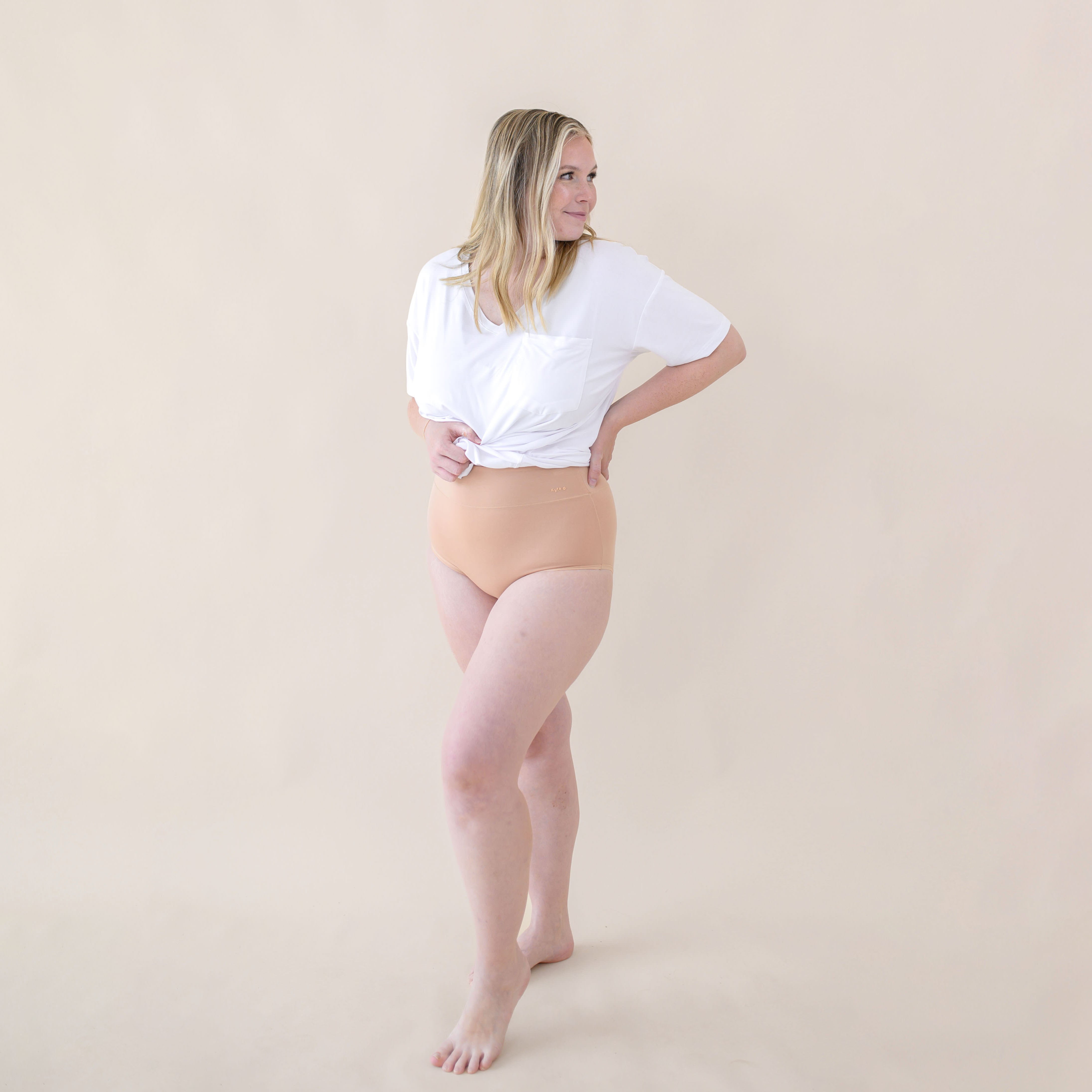 Woman modeling Women's High-Waisted Brief in Chai and snow v-neck