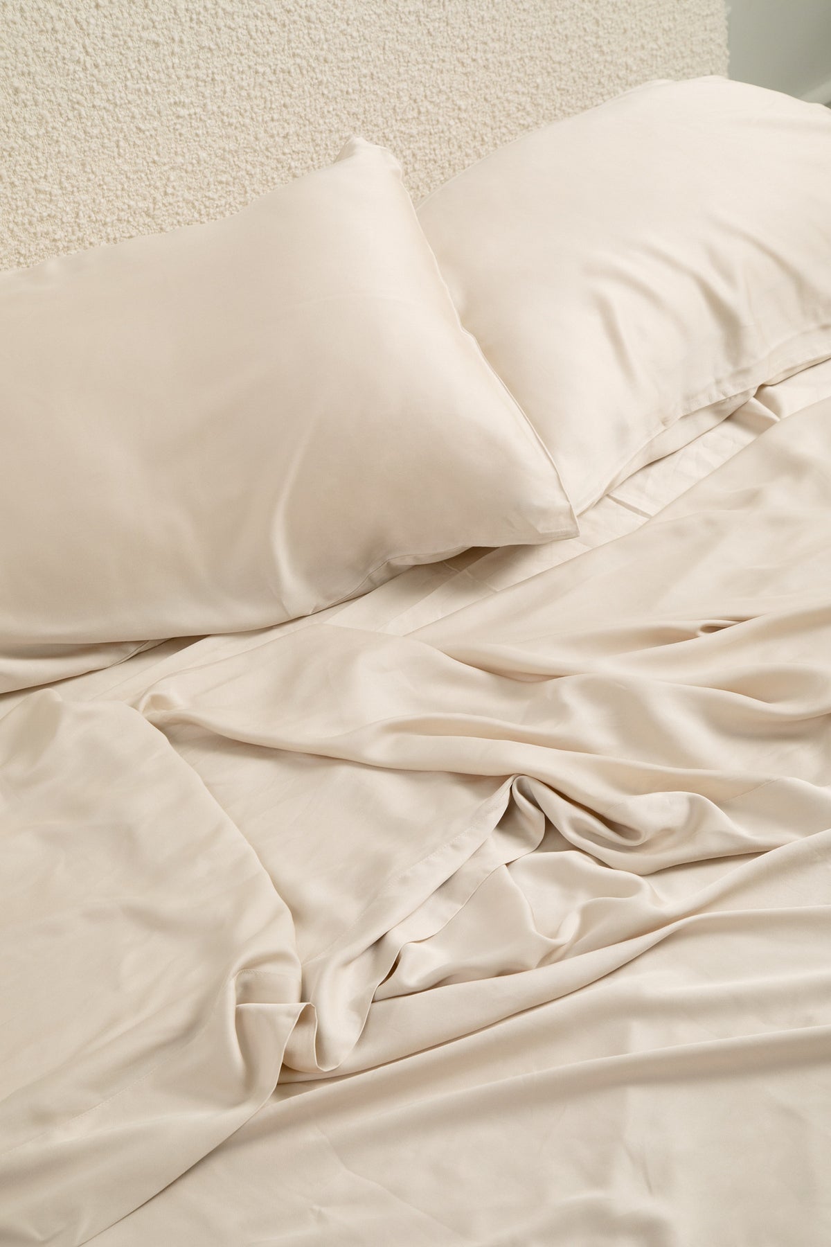 Close up of the Bamboo Sateen Sheet Set in Champagne shown on a bed