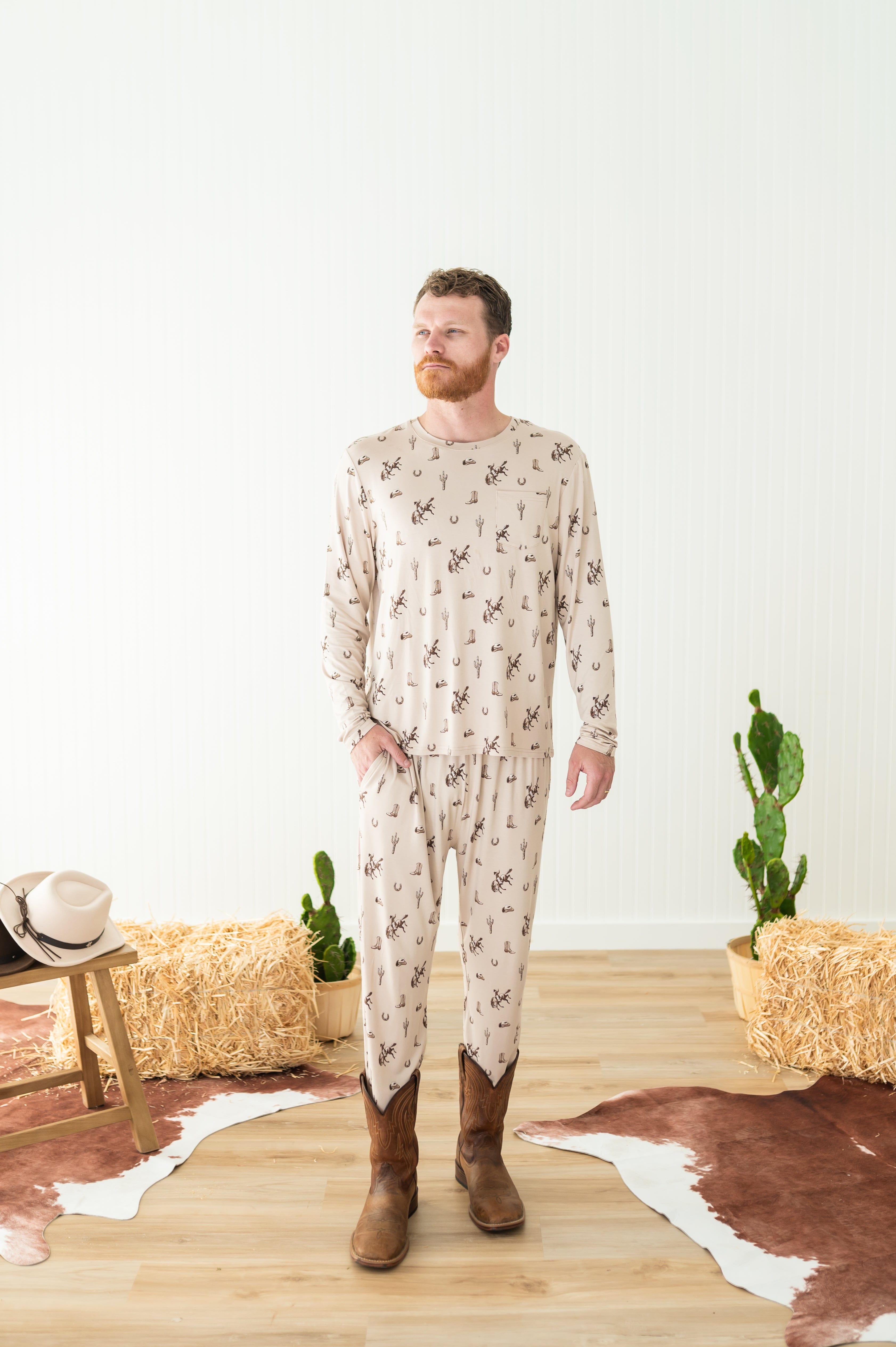 Male model wearing the Men's Jogger Set in Classic Cowboy in front of a western inspired backdrop