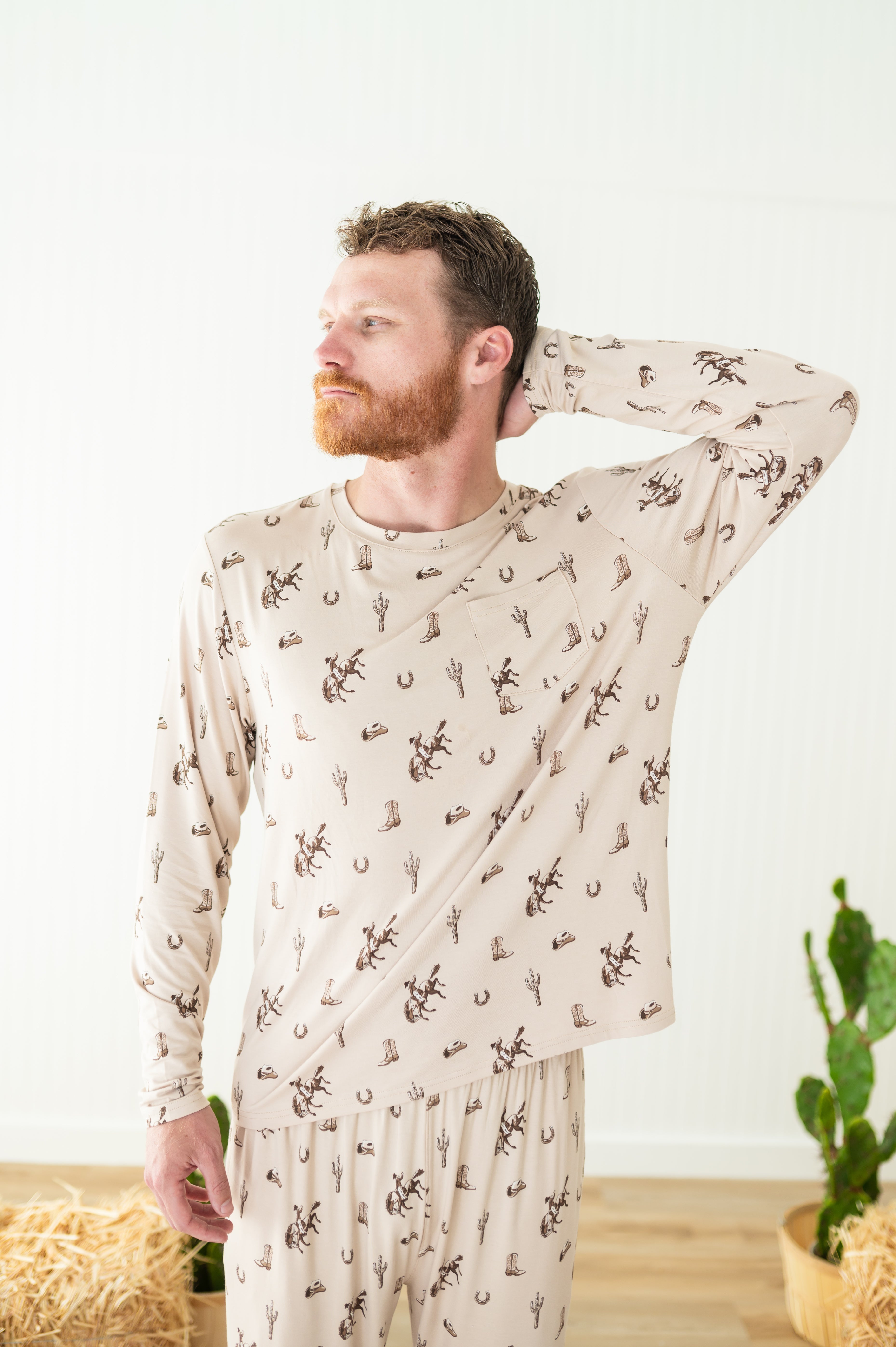 Male modeling the shirt on the Men's Jogger Set in Classic Cowboy with one arm behind his head