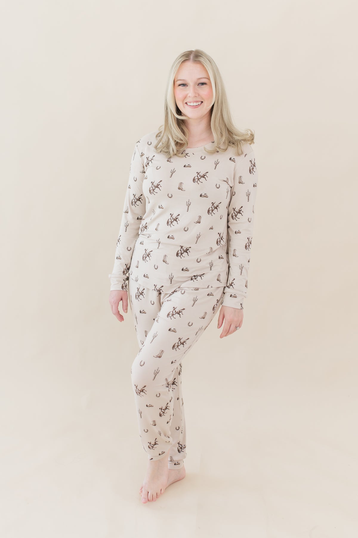 Female model posing wearing the Women's Jogger Pajama Set in Classic Cowboy in front of a light neutral backdrop