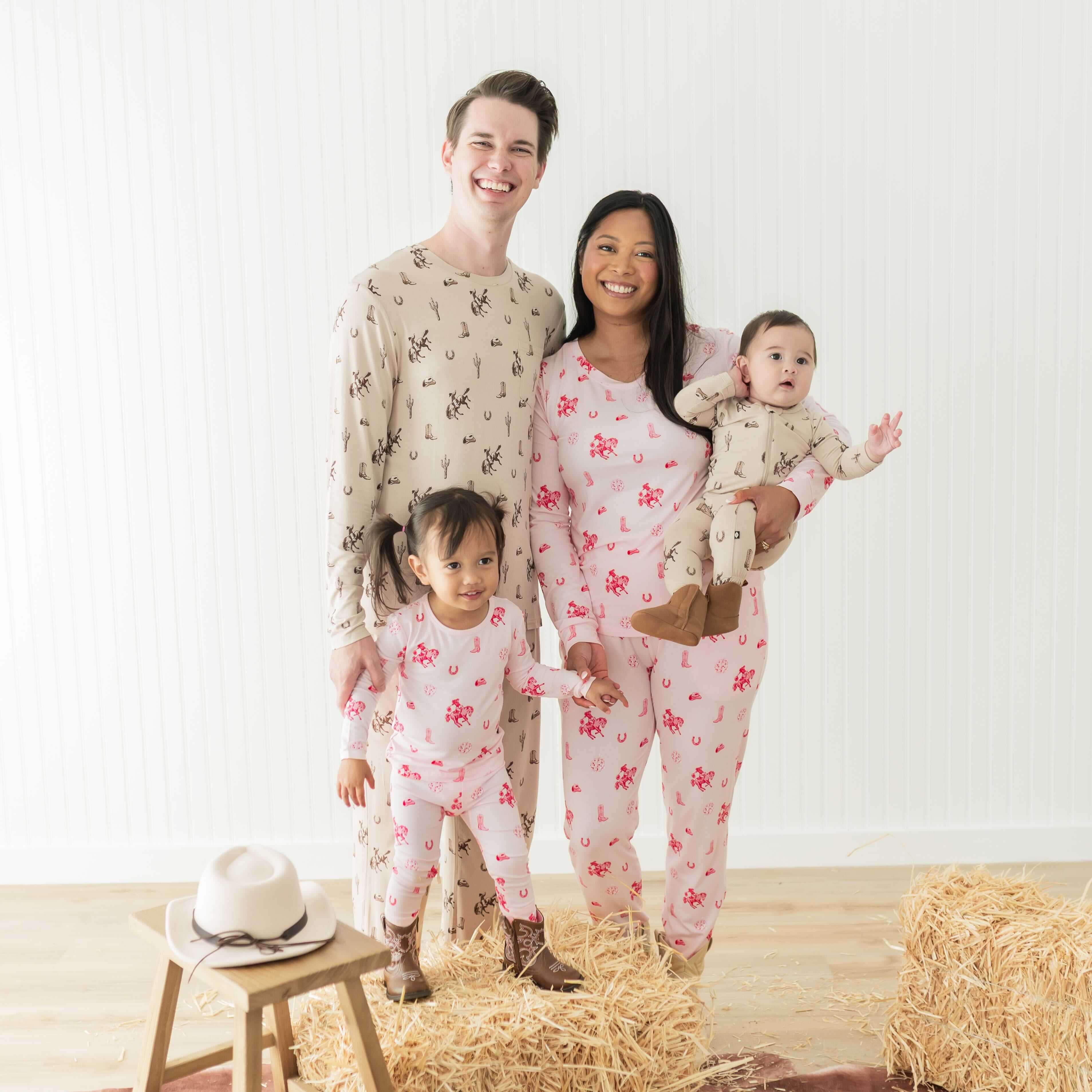 Family of four wearing various items from the classic cowboy and disco cowgirl collection