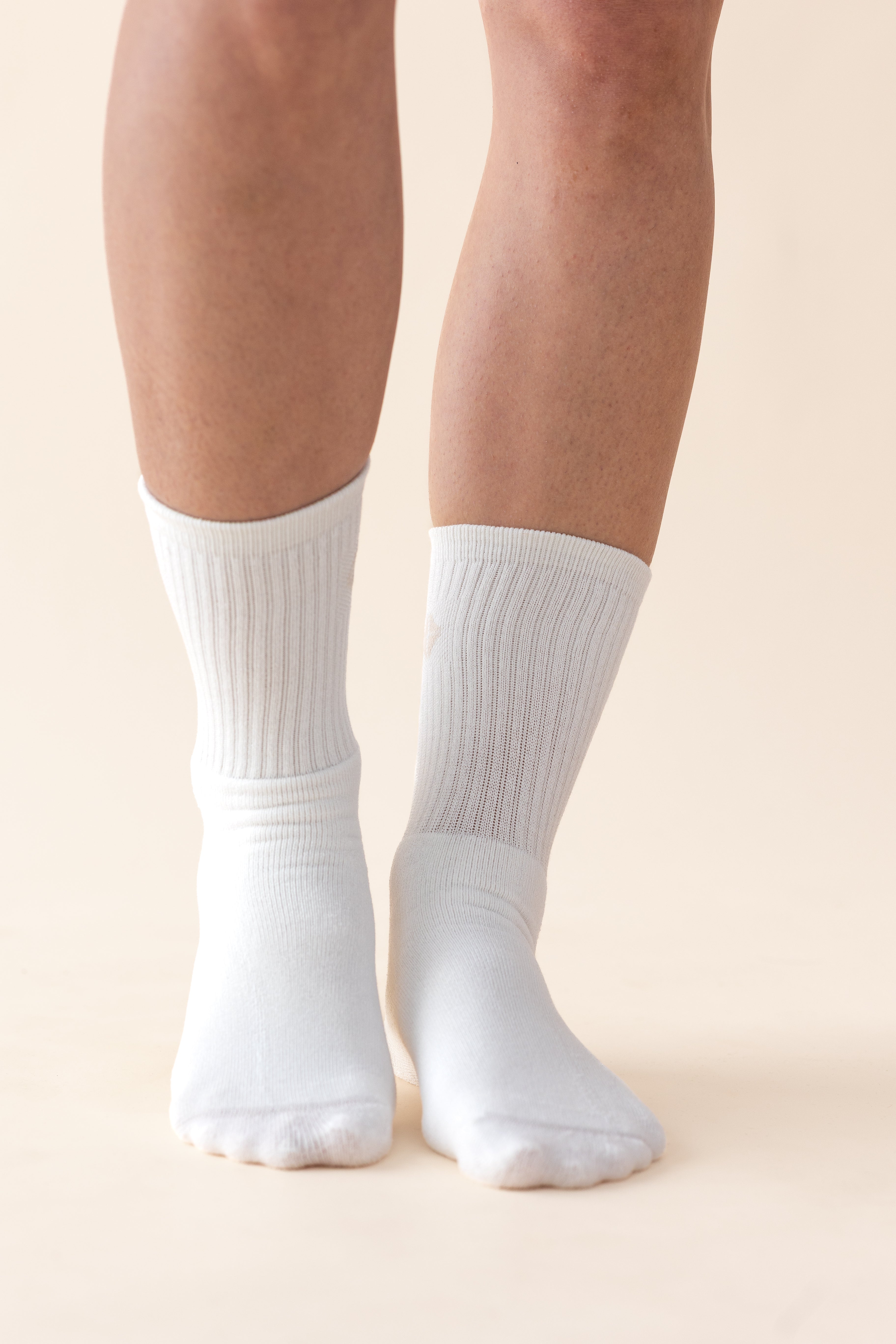 The front of the Adult Crew Socks in Cloud shown on models feet