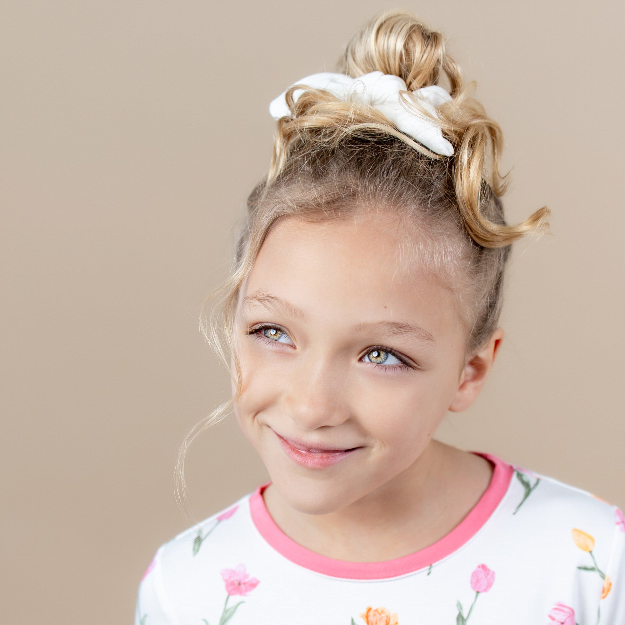 Scrunchie in Cloud shown in a young girls hair