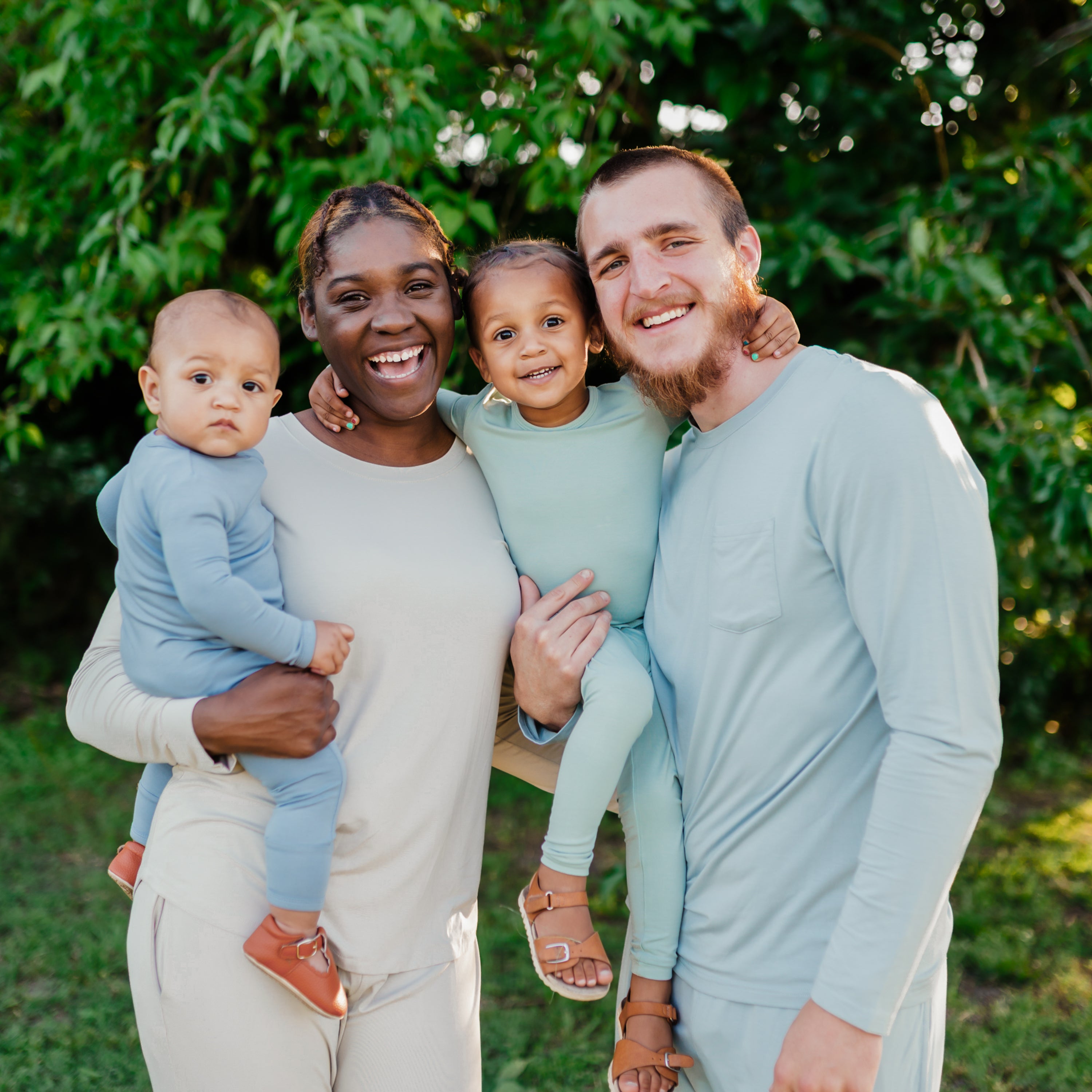 Family wearing long sleeve matching pajamas in Slate, Oat, Sage and Fog