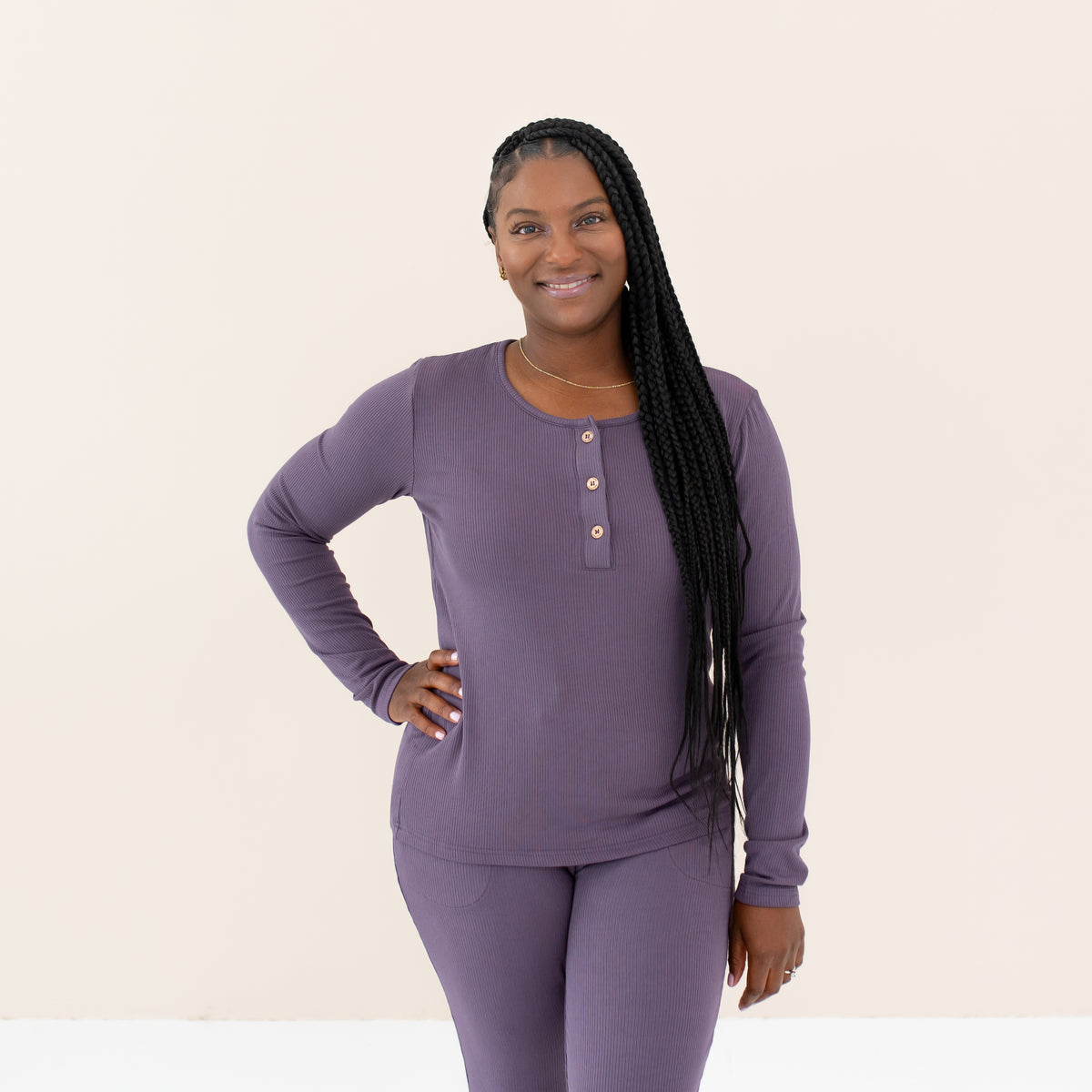 Woman modeling Women's Ribbed Henley Top in Currant
