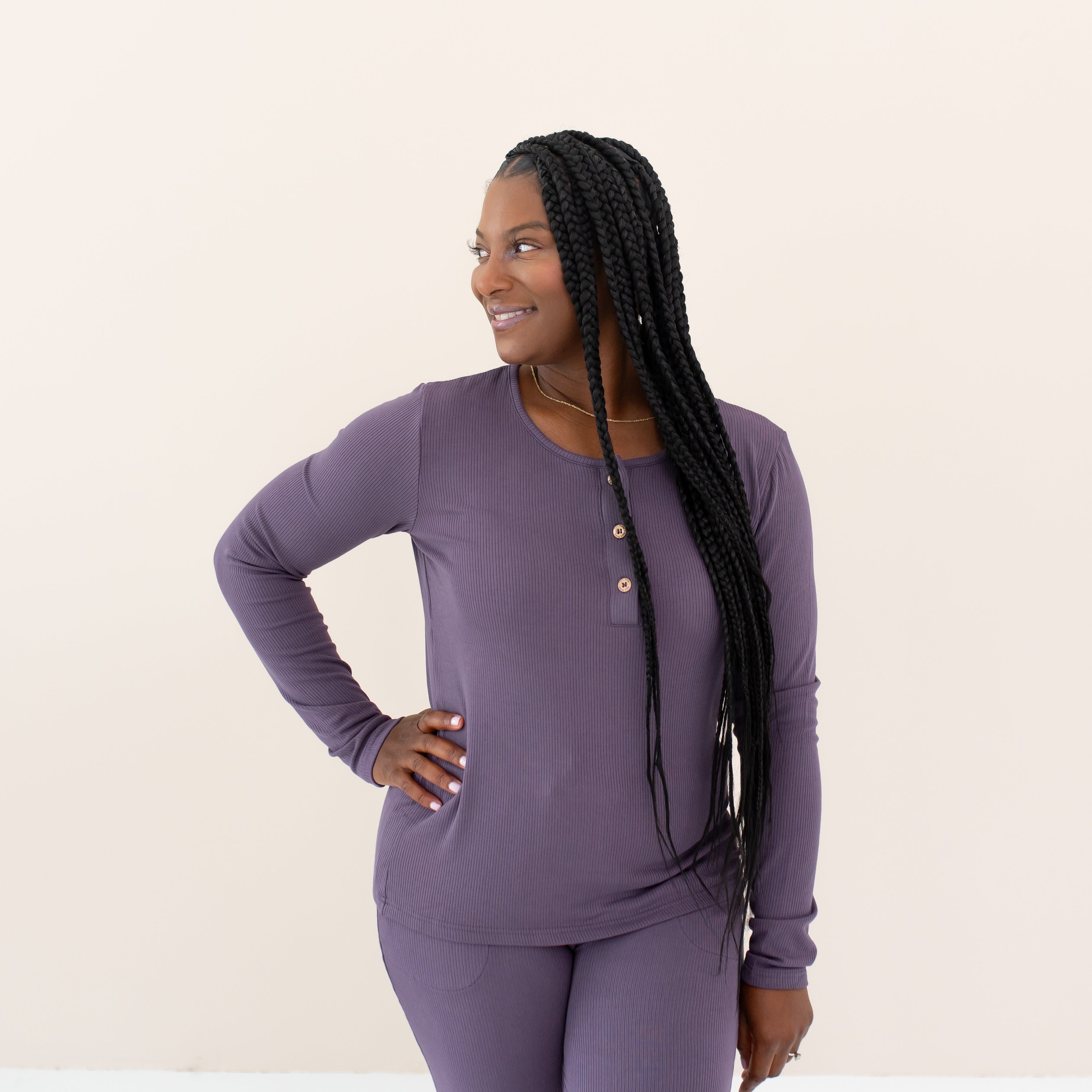 Woman modeling Women's Ribbed Henley Top in Currant looking off to the side