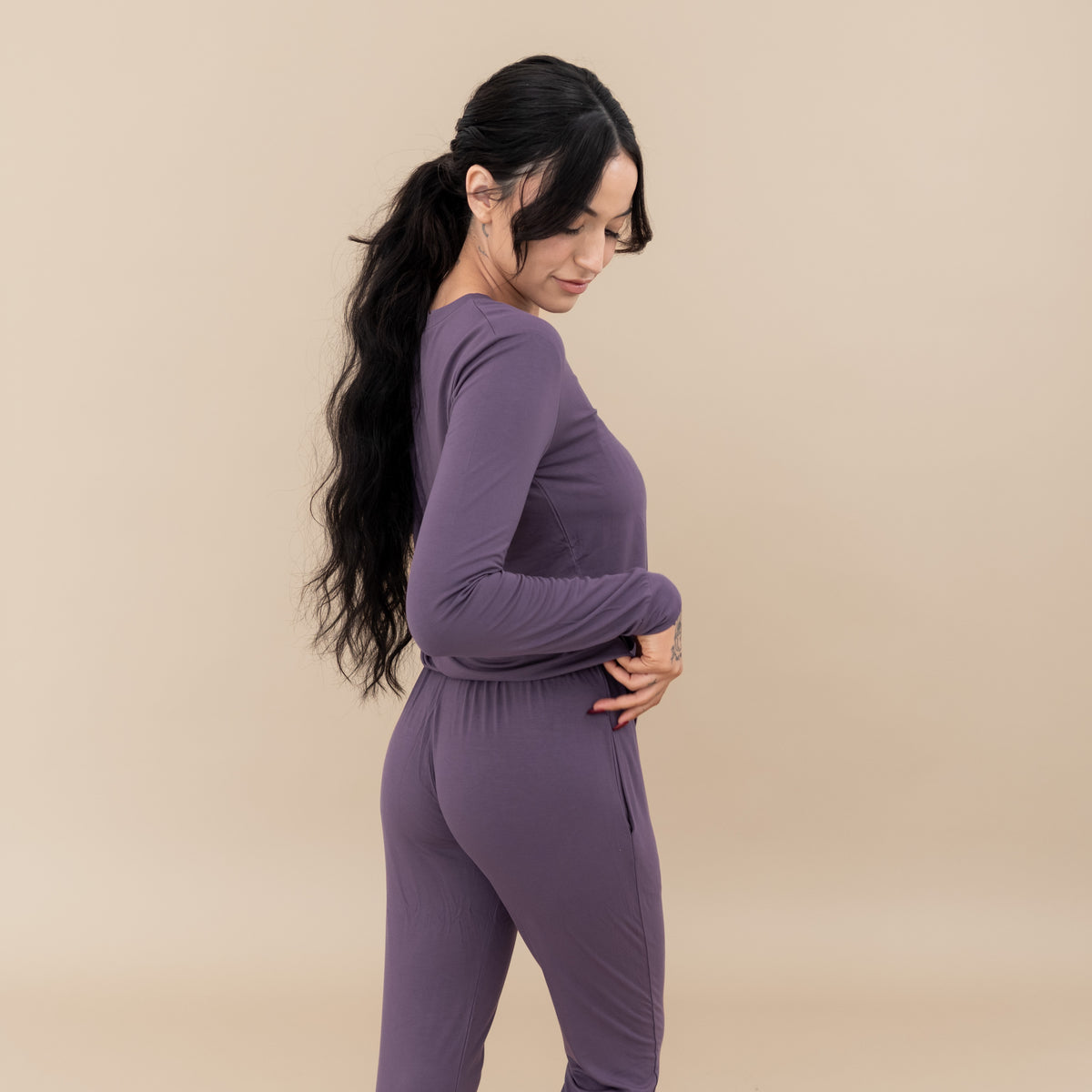 Woman modeling Women's Jogger Pajama Set in Currant showing back on joggers