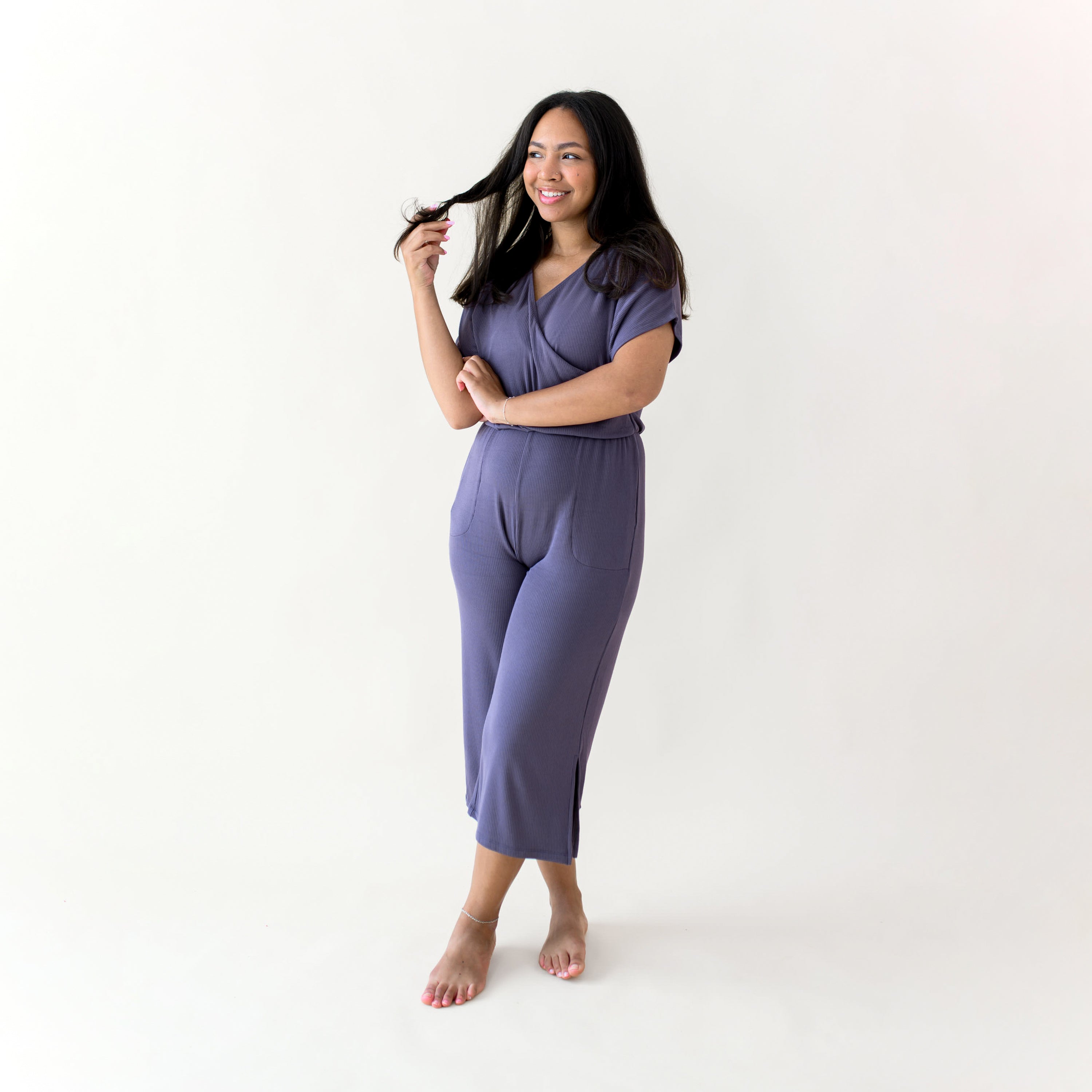 Woman modeling Women's Ribbed Jumpsuit in Currant