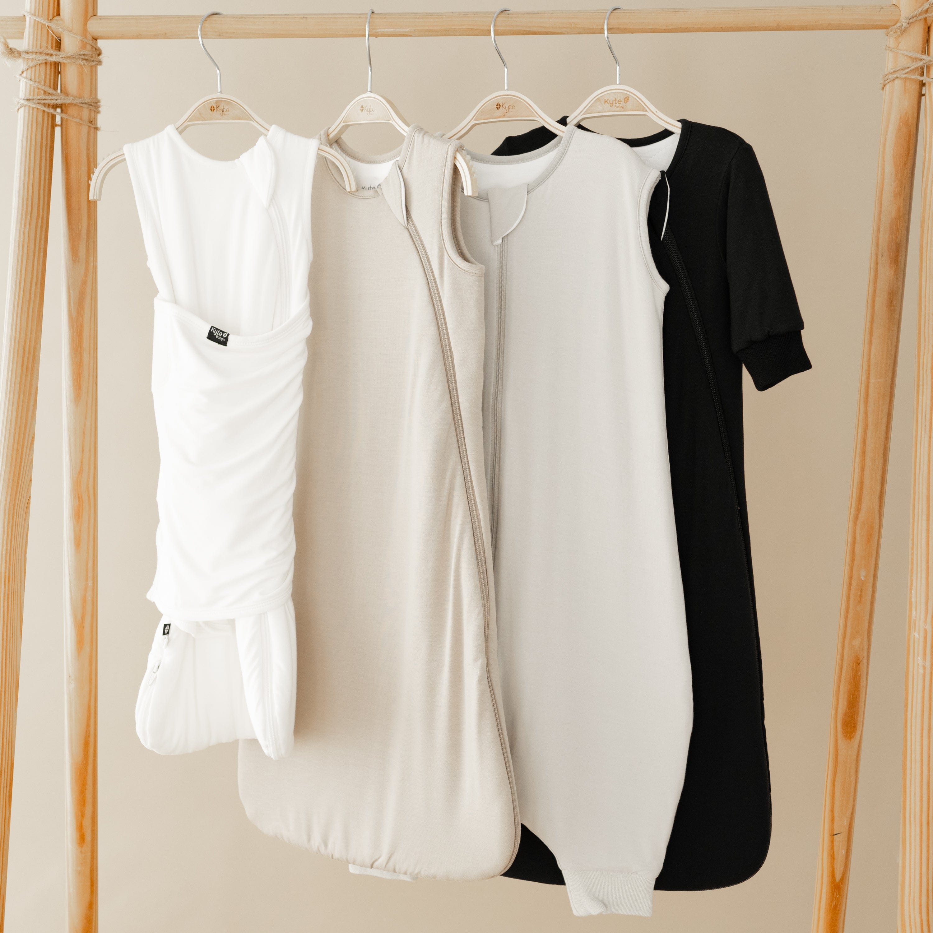 image showing different Kyte Baby sleep solutions including sleep bag swaddler, sleep bag, sleep bag walker and slumber bag