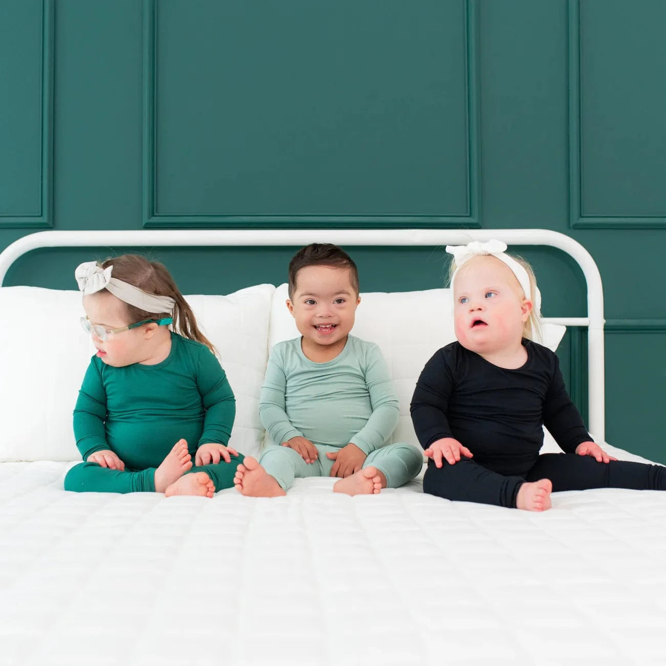 3 toddlers with down syndrome in kyte baby pajamas