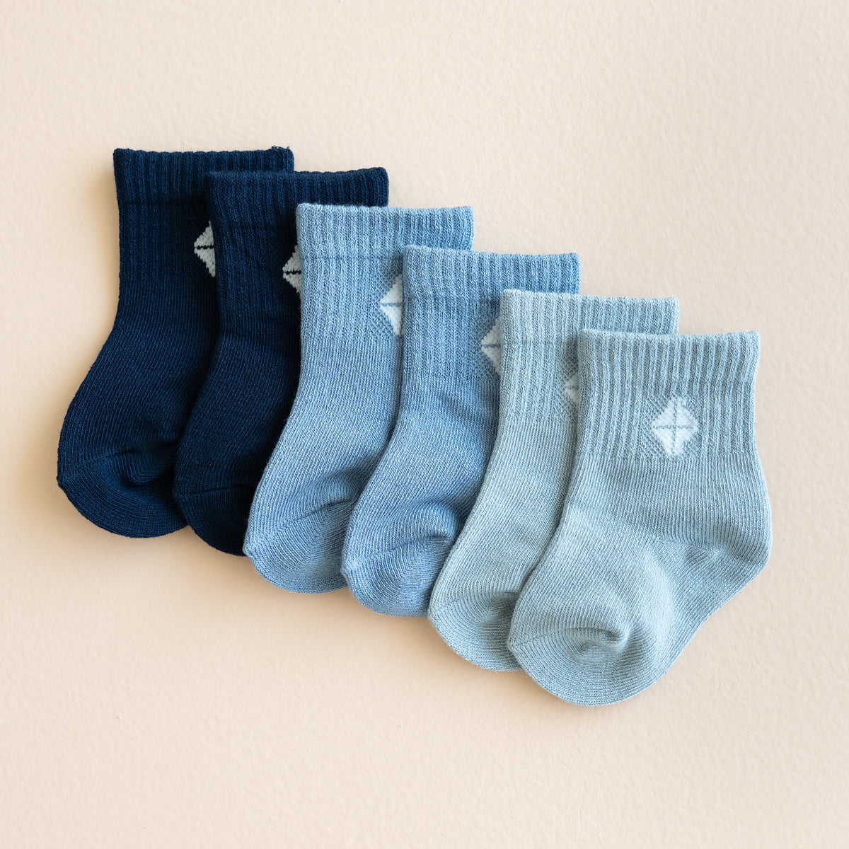 Flat lay in the Crew Socks Combo 3-Pack in Cool showing colors Navy, Slate and Fog