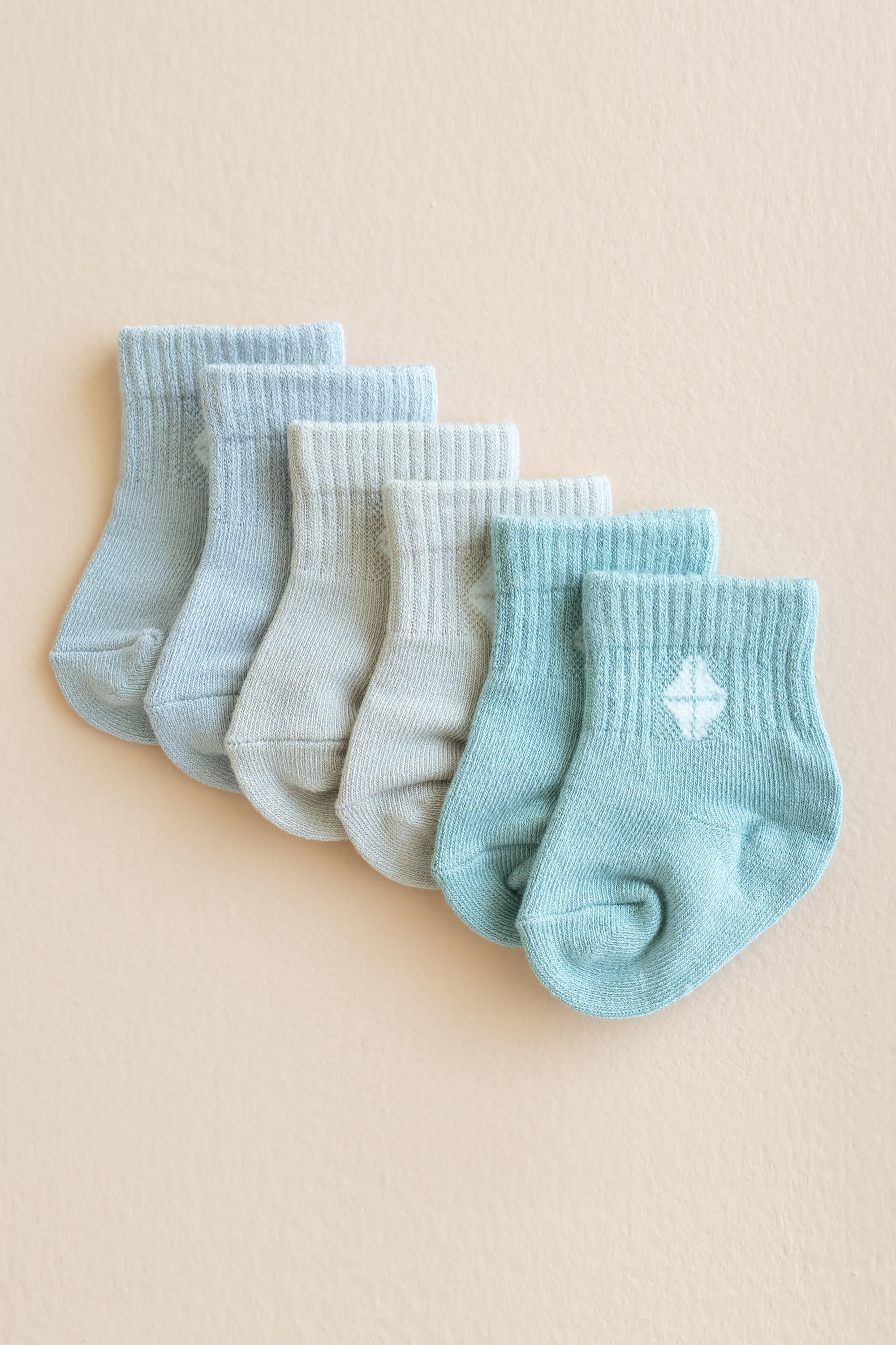 Flat lay of the Crew Socks Combo 3-Pack in Neutral showing colors Storm, Oat and Sage