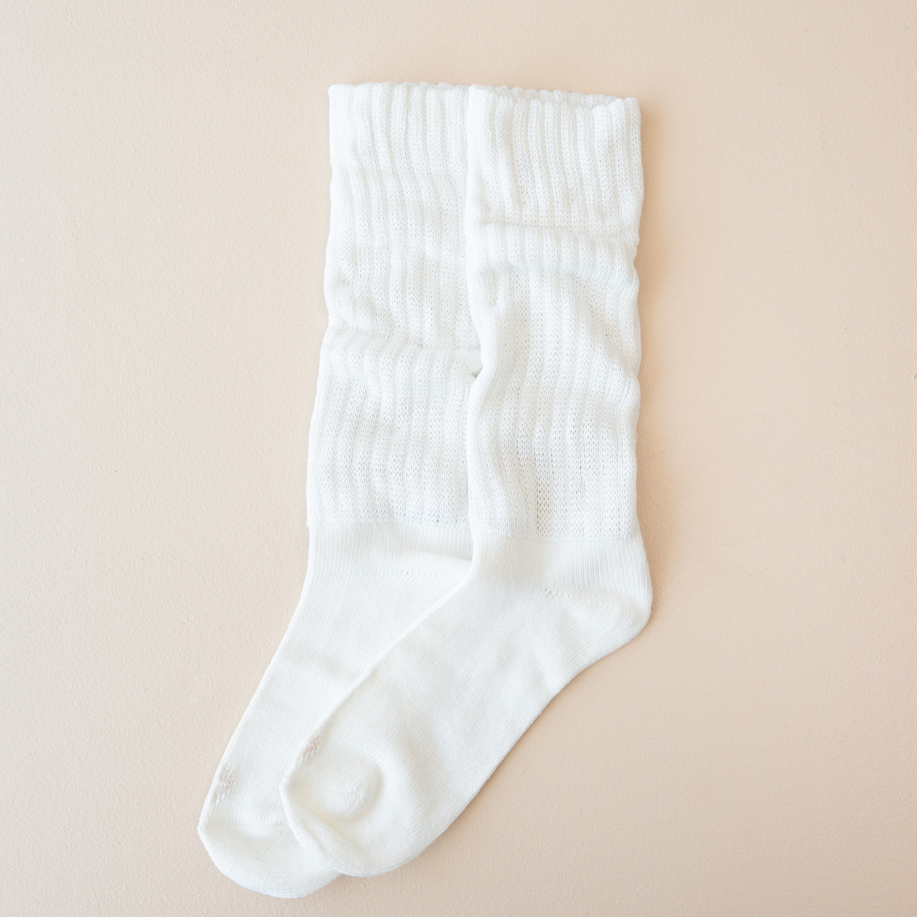 Adult Scrunch Socks in Cloud shown out of package laid side by side on a light neutral background