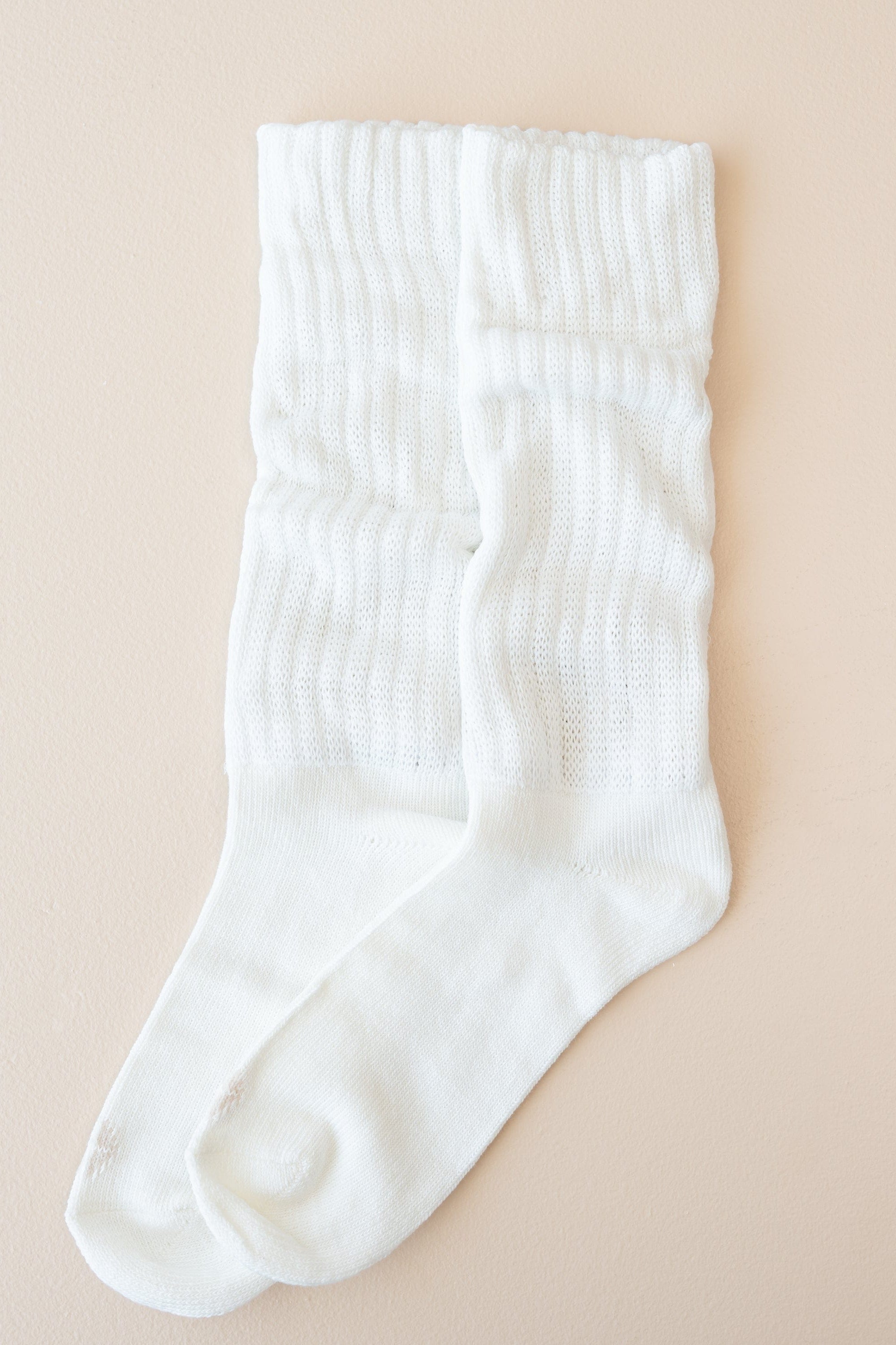 Adult Scrunch Socks in Cloud shown out of package laid side by side on a light neutral background
