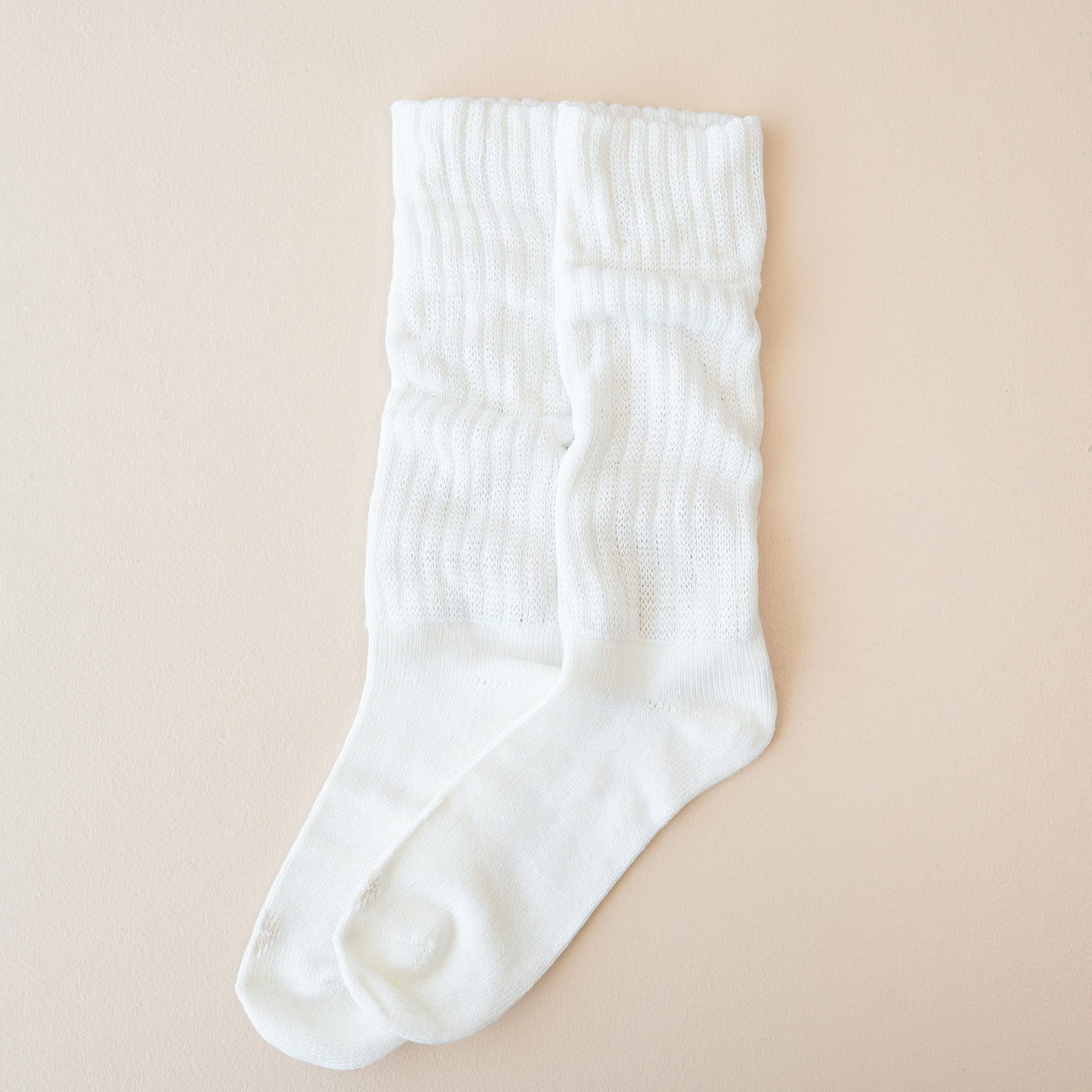 Adult Scrunch Socks in Cloud shown out of package laid side by side on a light neutral background