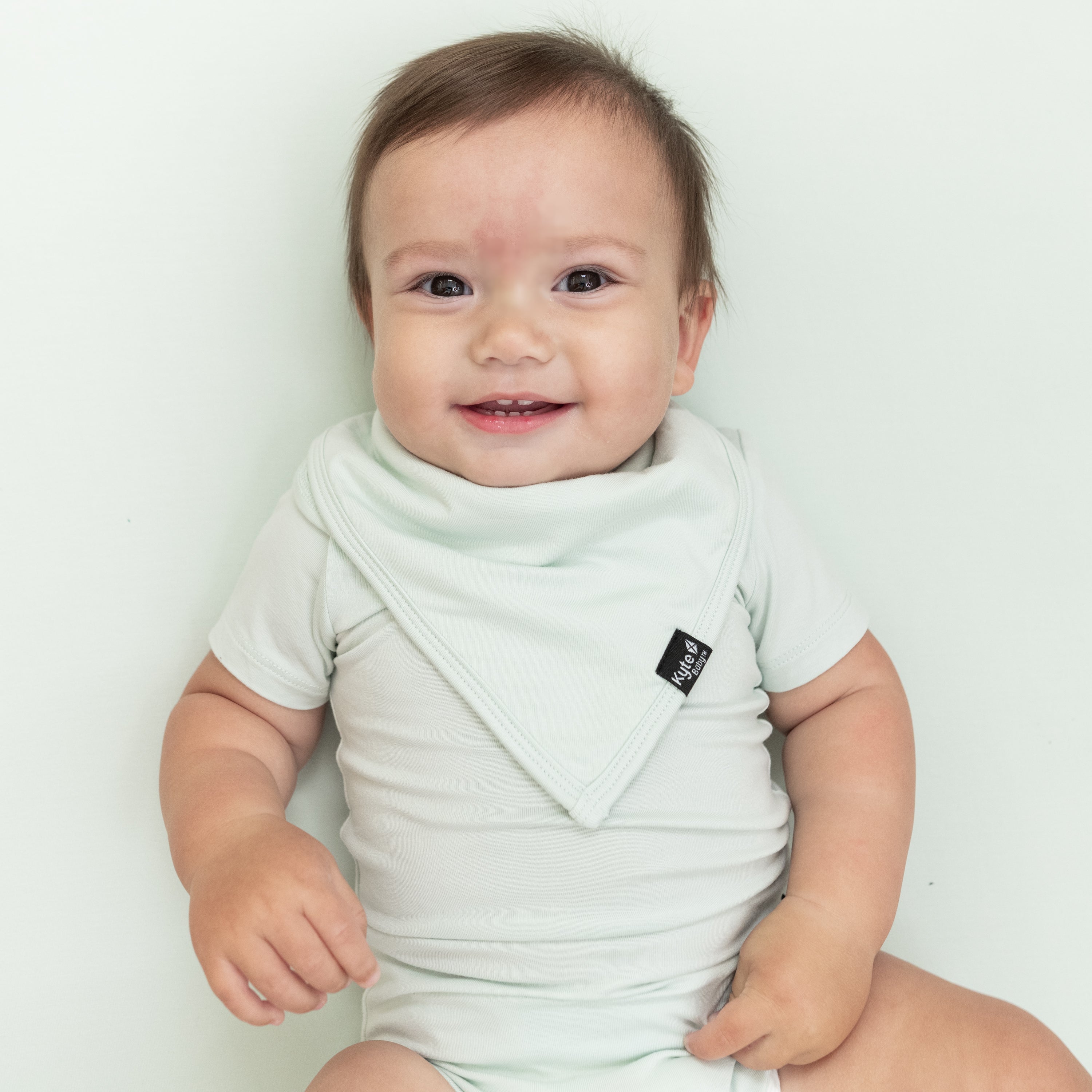 Infant wearing the Bib in Dew with matching Short Sleeve Bodysuit in Dew