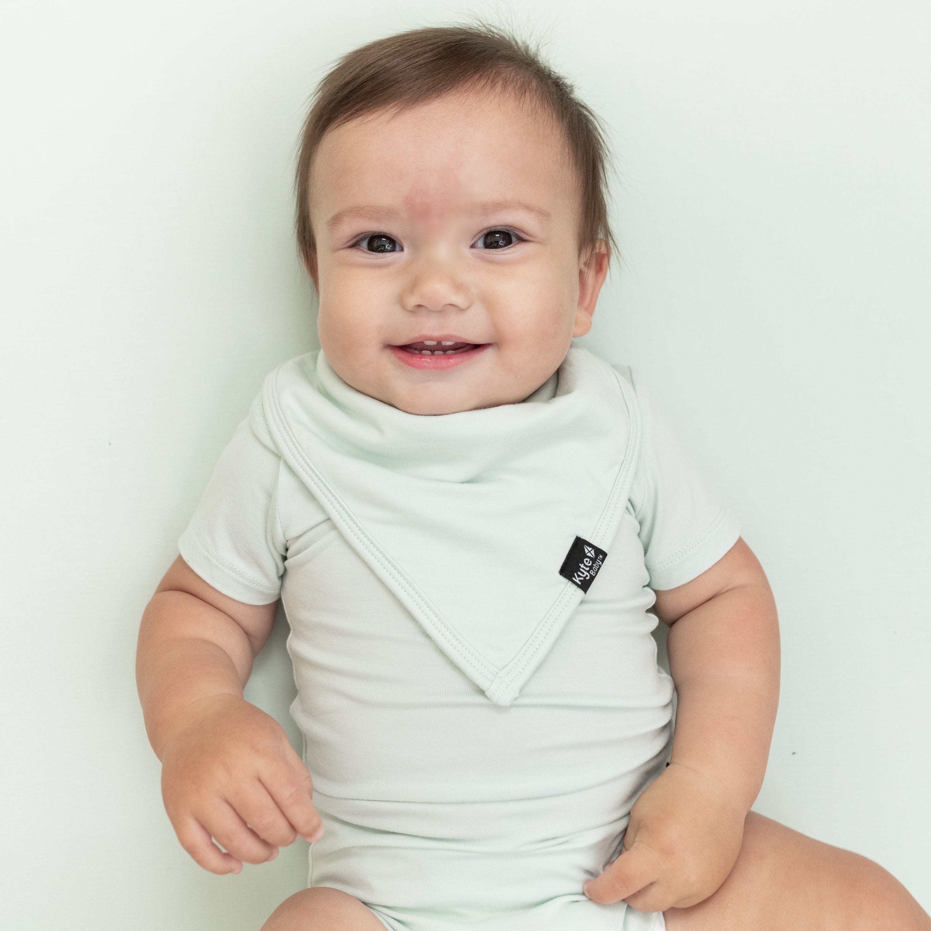 Infant wearing the Bib in Dew with matching Short Sleeve Bodysuit in Dew