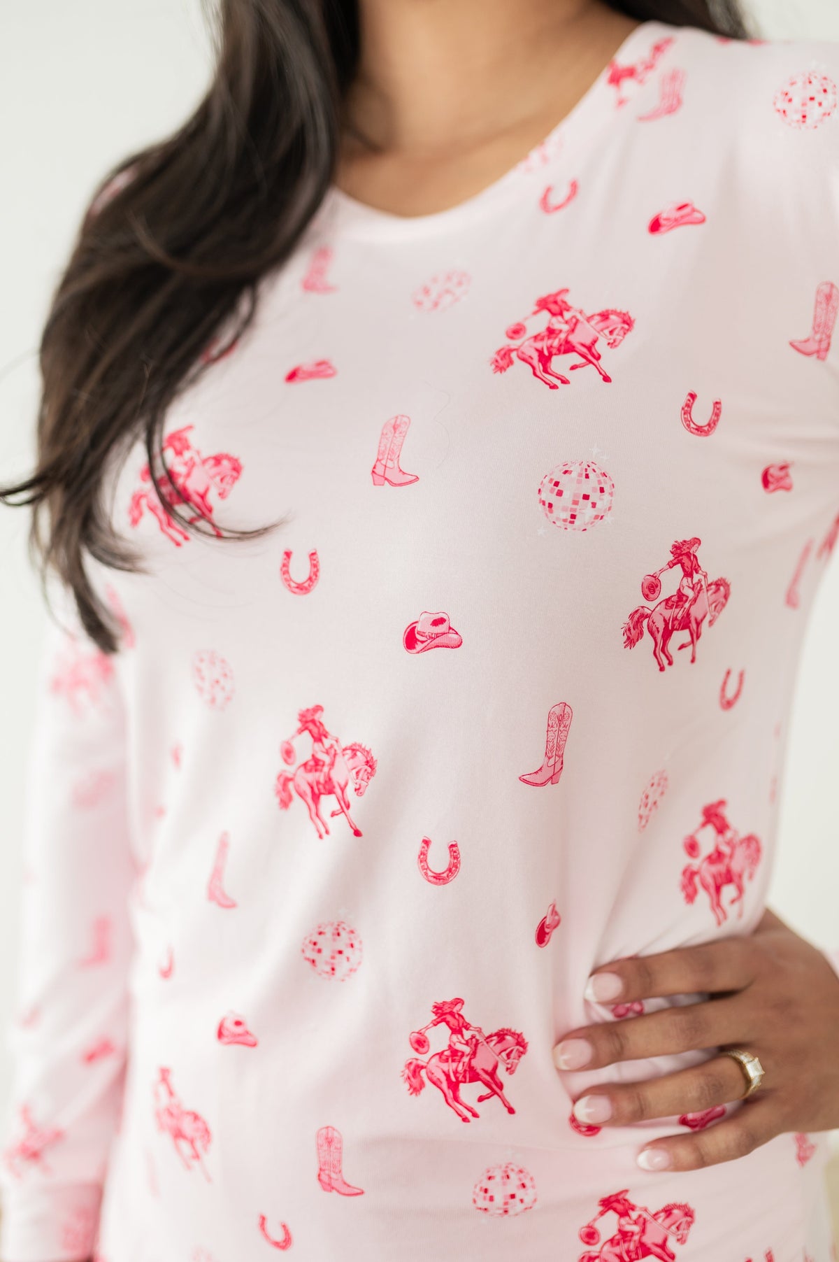 Close up of the print on the shirt of the Women's Jogger Pajama Set in Disco Cowgirl shown on a model
