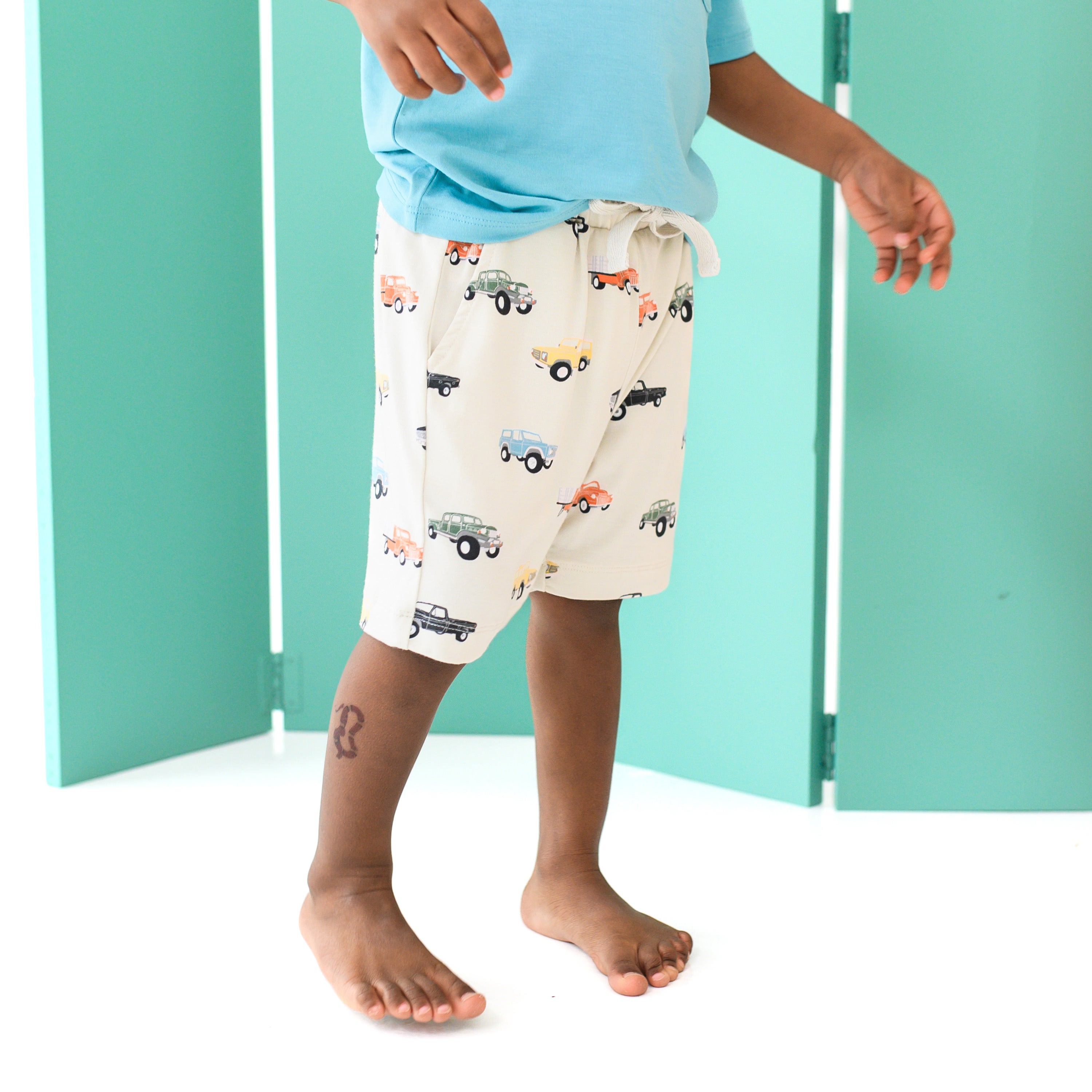 Toddler wearing Drawstring Short in Vintage Truck pattern
