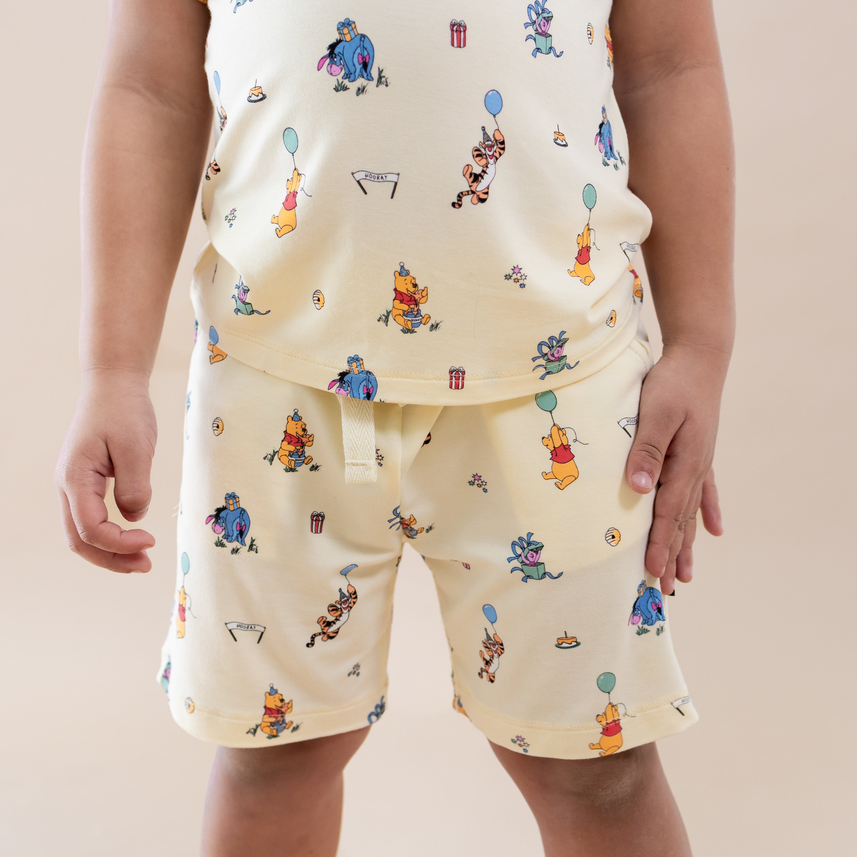 Close up of the Drawstring Short in Winnie the Pooh Celebration on a young model