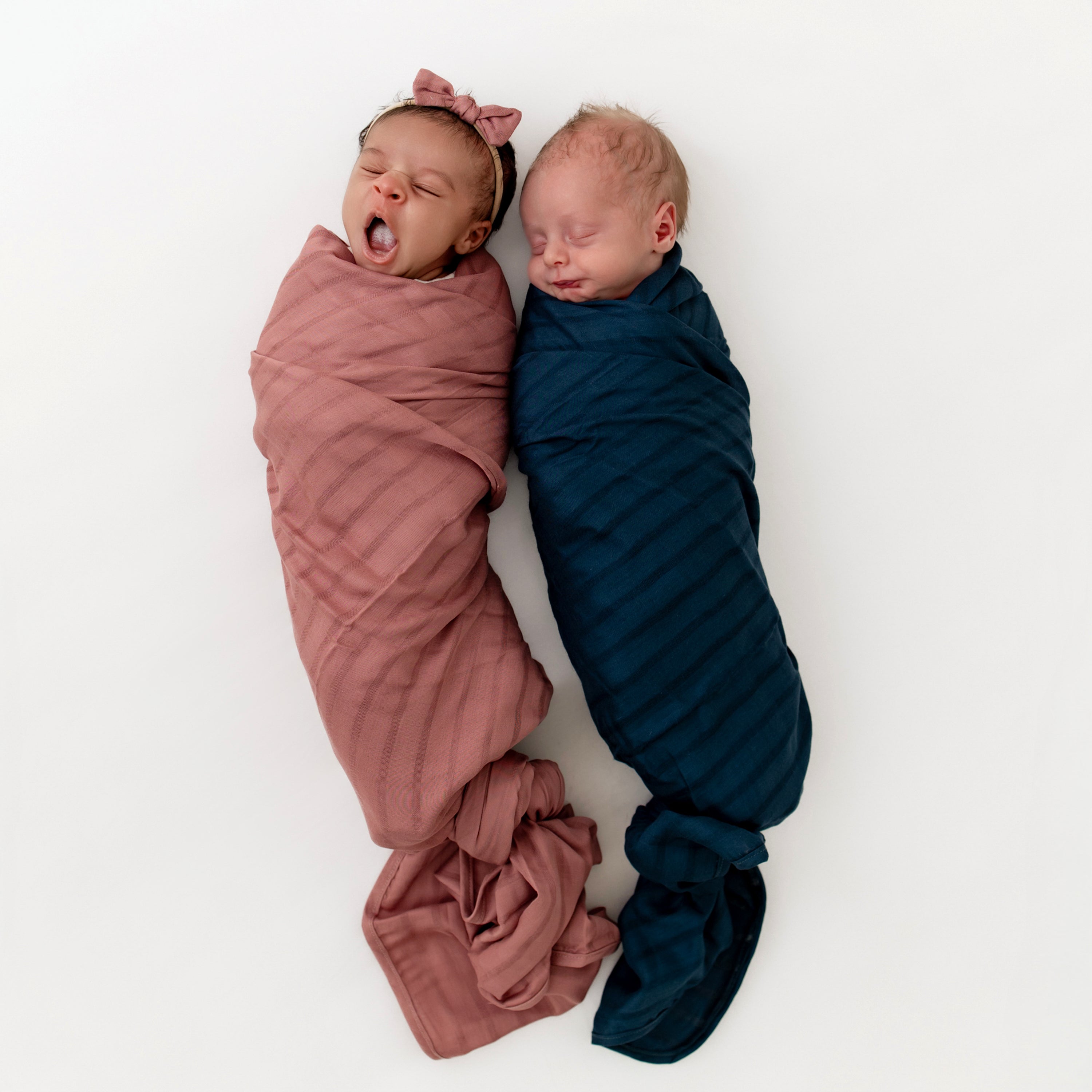 Babies wrapped in Bamboo Muslin Swaddle Blankets