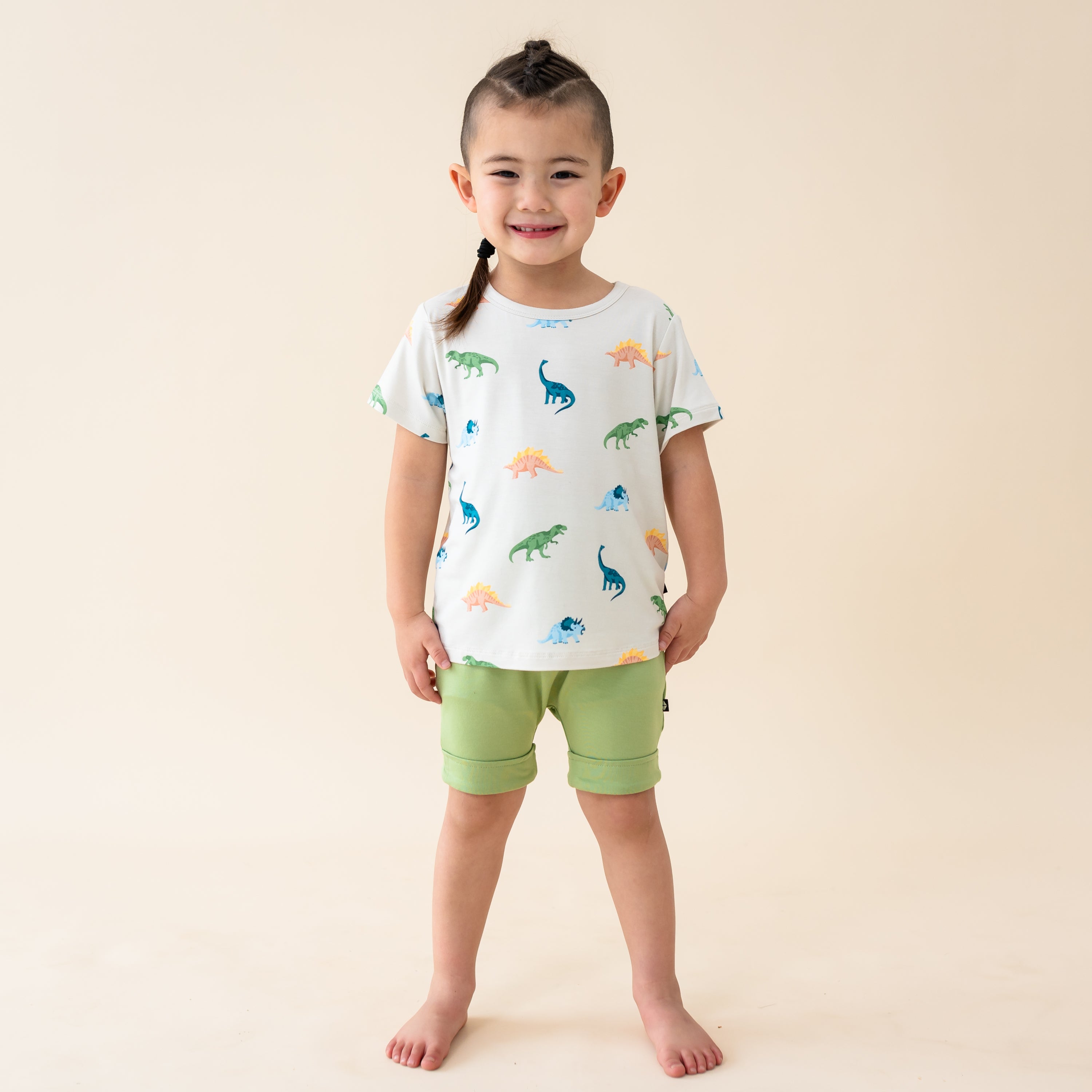 Child modeling the Toddler Basic Tee in Ecru Roar