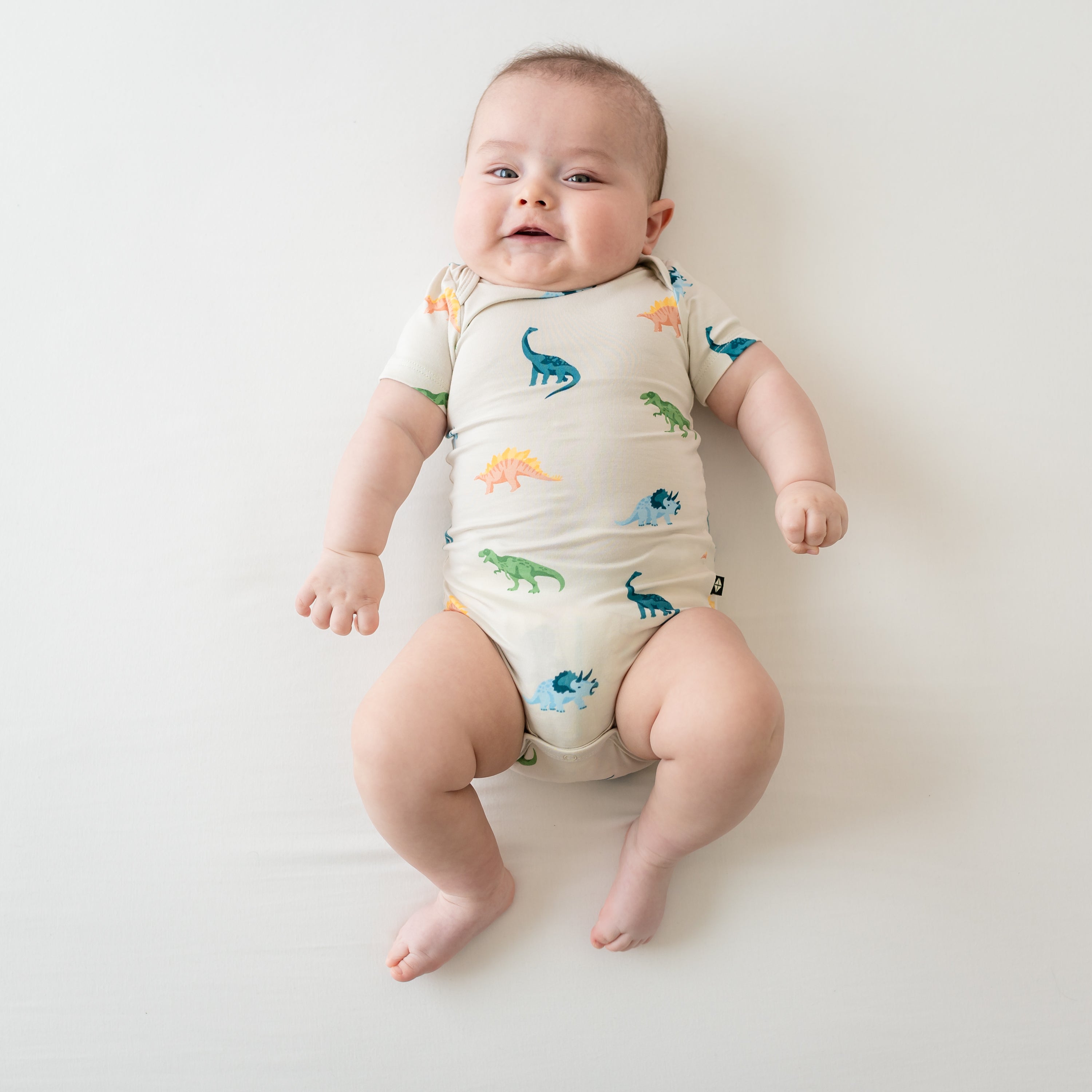 Infant shown in Ecru Roar Short Sleeve Bodysuit