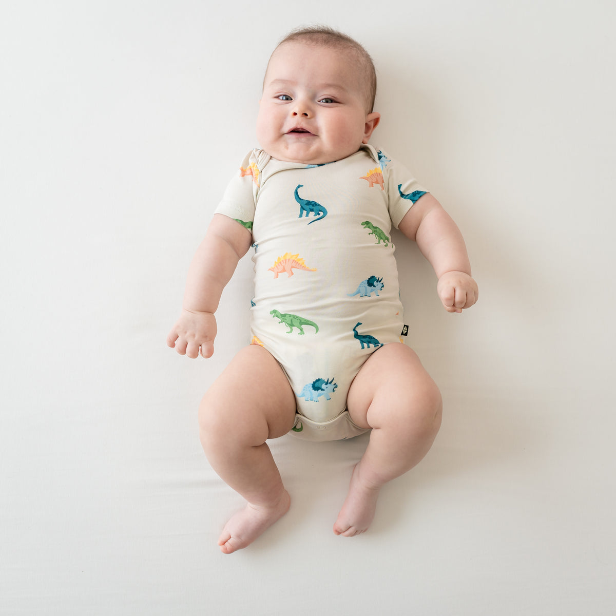 Infant shown in Ecru Roar Short Sleeve Bodysuit