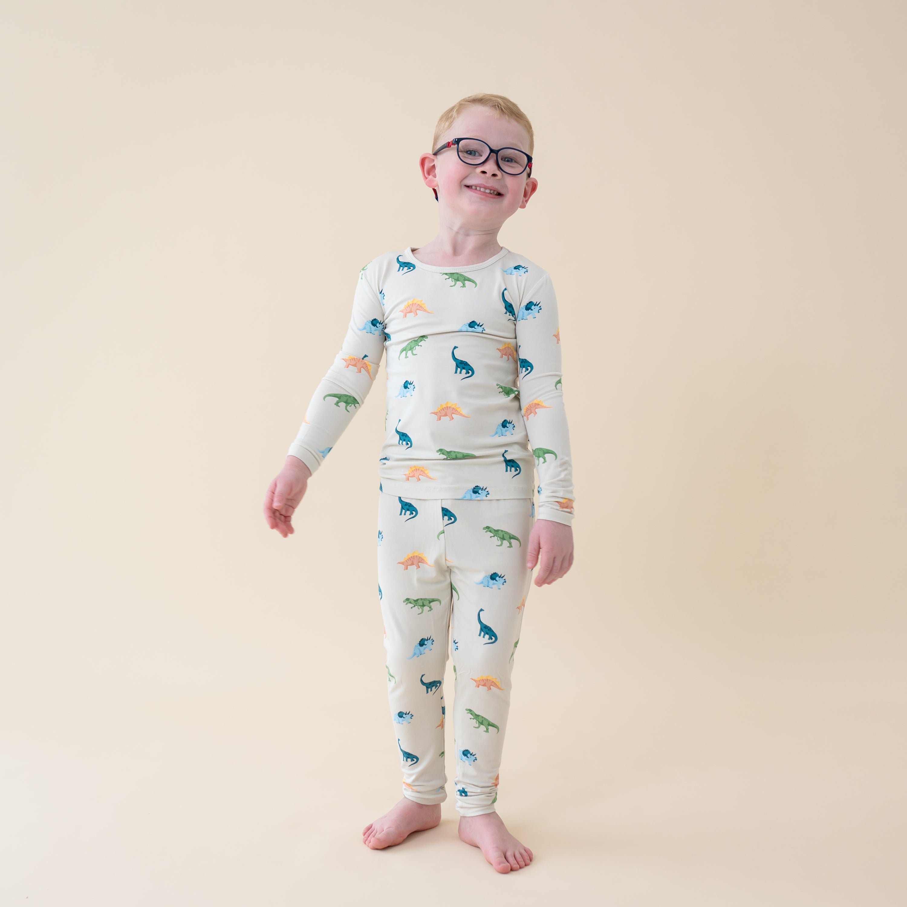 Child wearing Long Sleeve Toddler Pajama Set in Ecru Roar