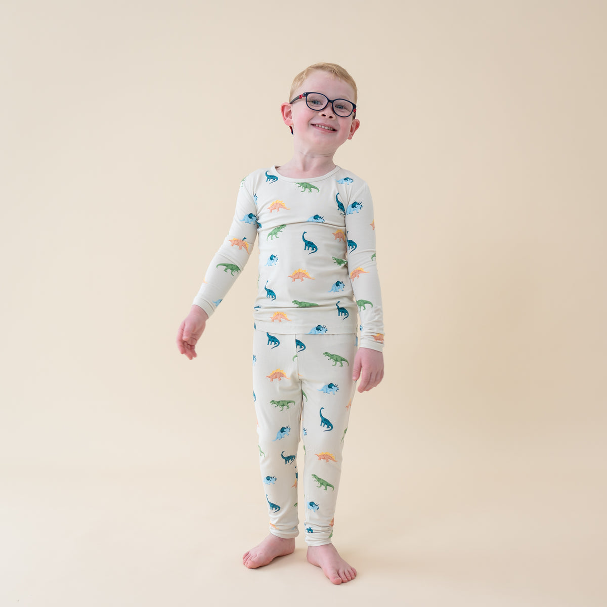 Child wearing Long Sleeve Toddler Pajama Set in Ecru Roar