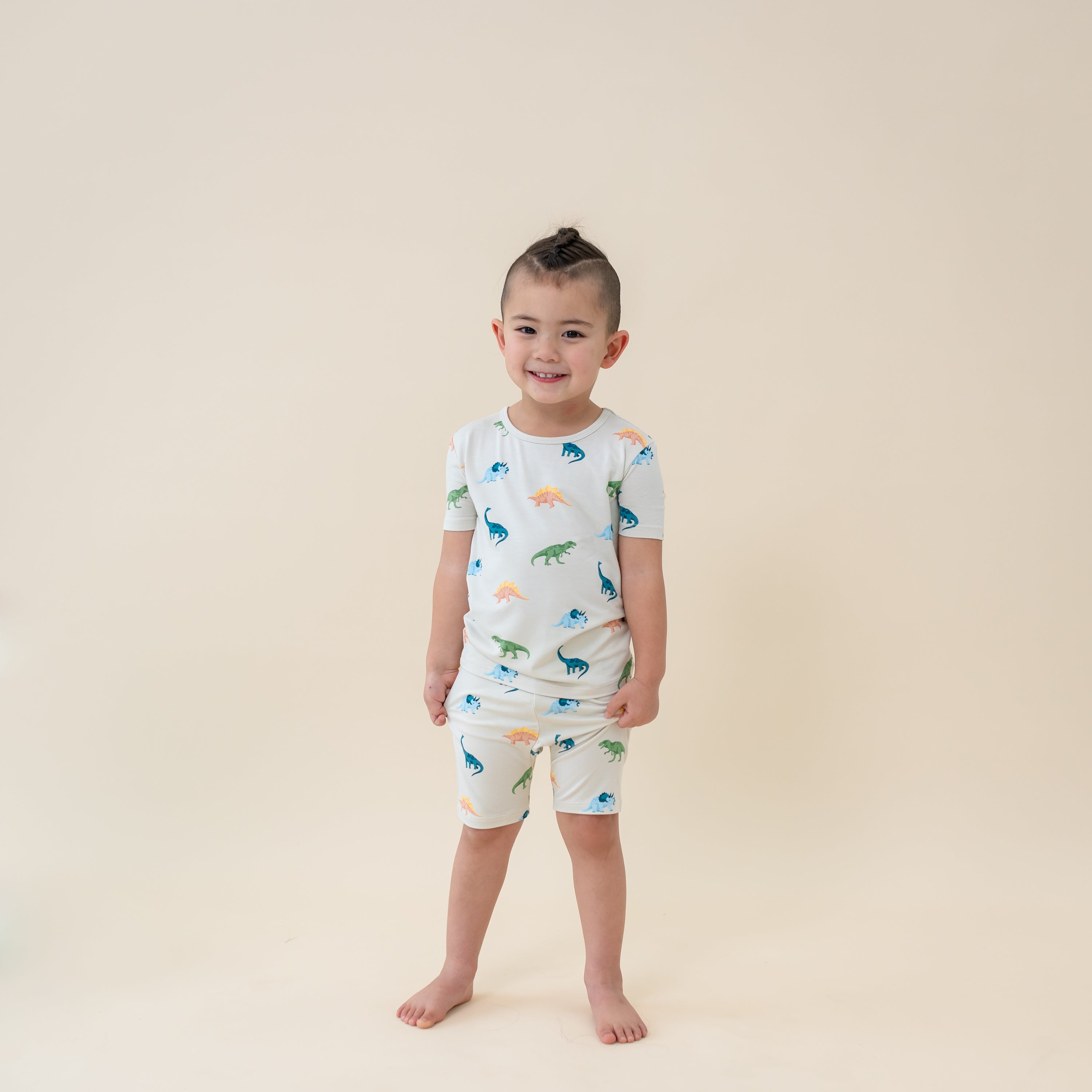 Child wearing Short Sleeve Toddler Pajama set in Ecru Roar