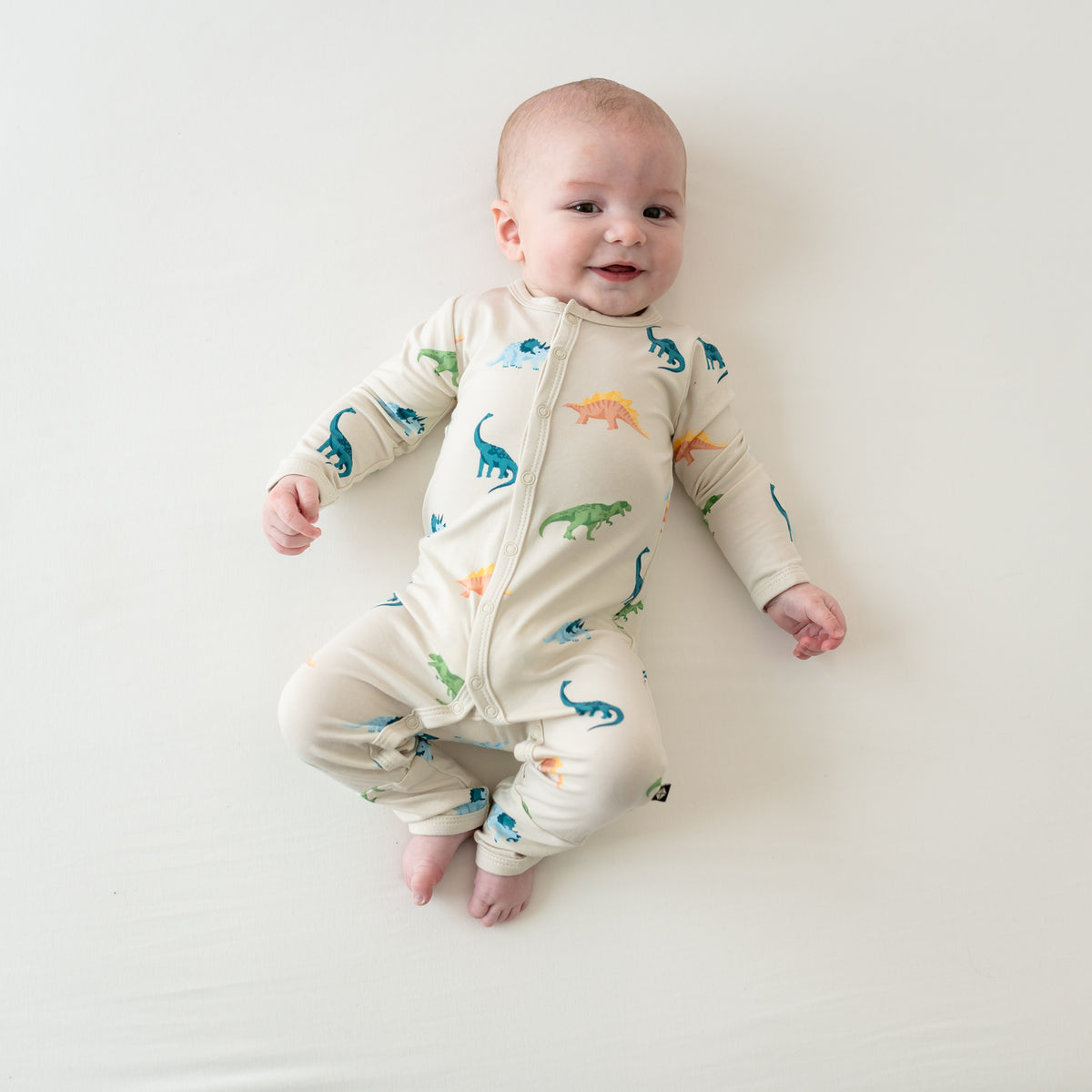 Smiling Baby in Ecru Roar Snap Romper