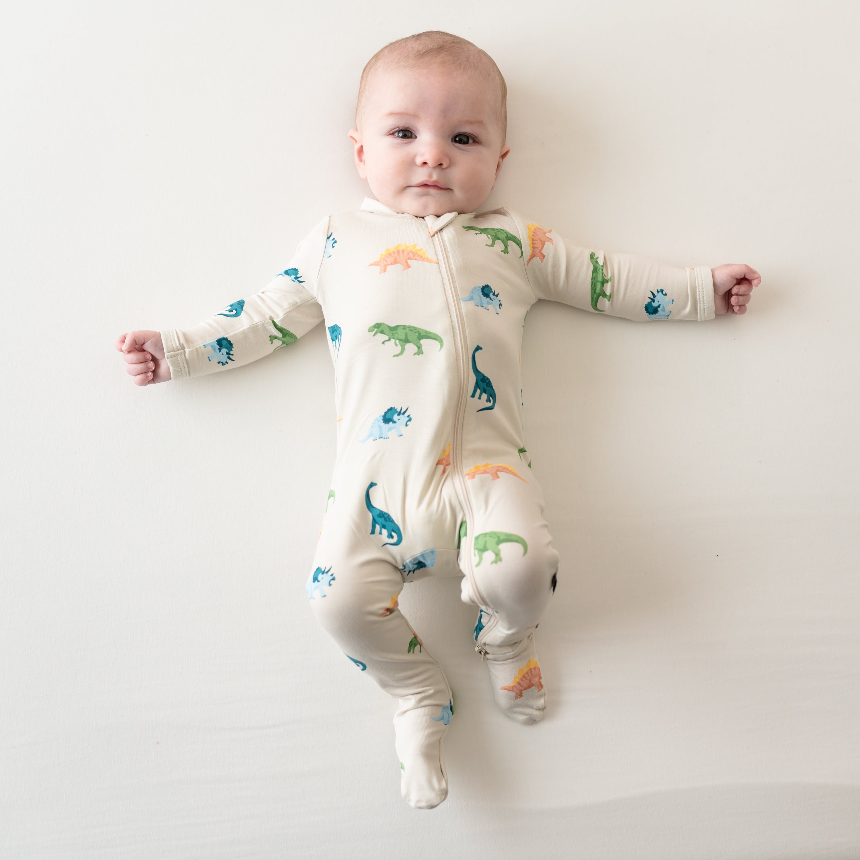 Infant shown in Ecru Roar Zippered Footie