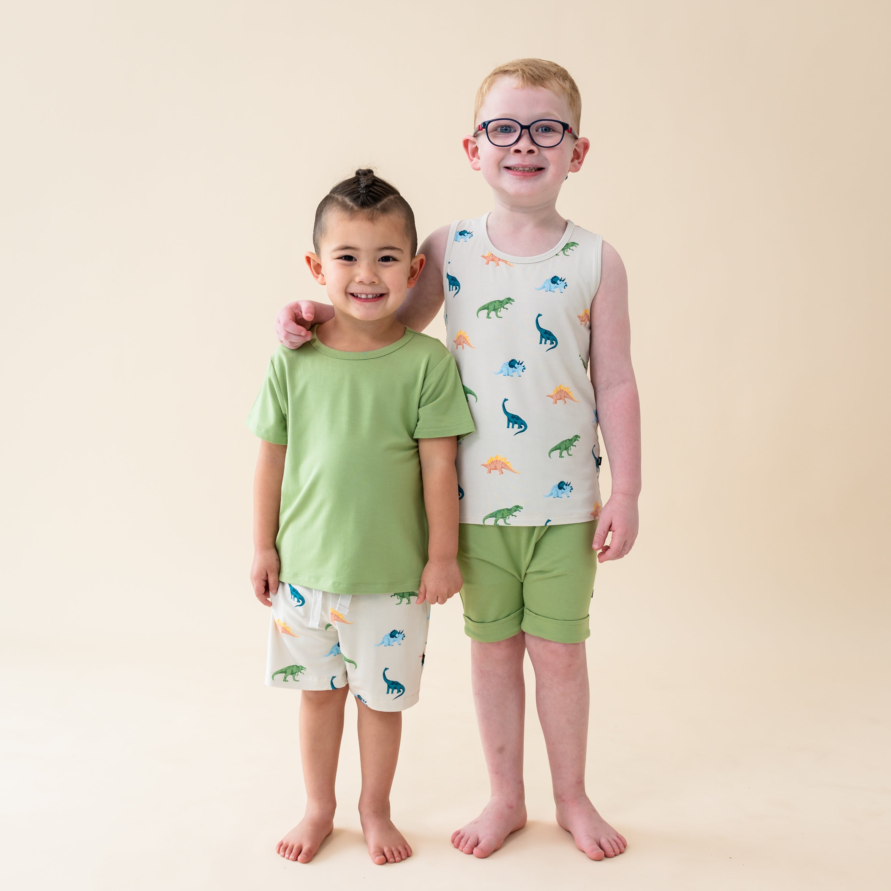 Two models in Ecru Roar. Model one wearing a Honu Basic Tee and Ecru Roar Drawstring shorts with model two wearing a Toddler Tank Top in Ecru Roar paired with Honu Harem Shorts