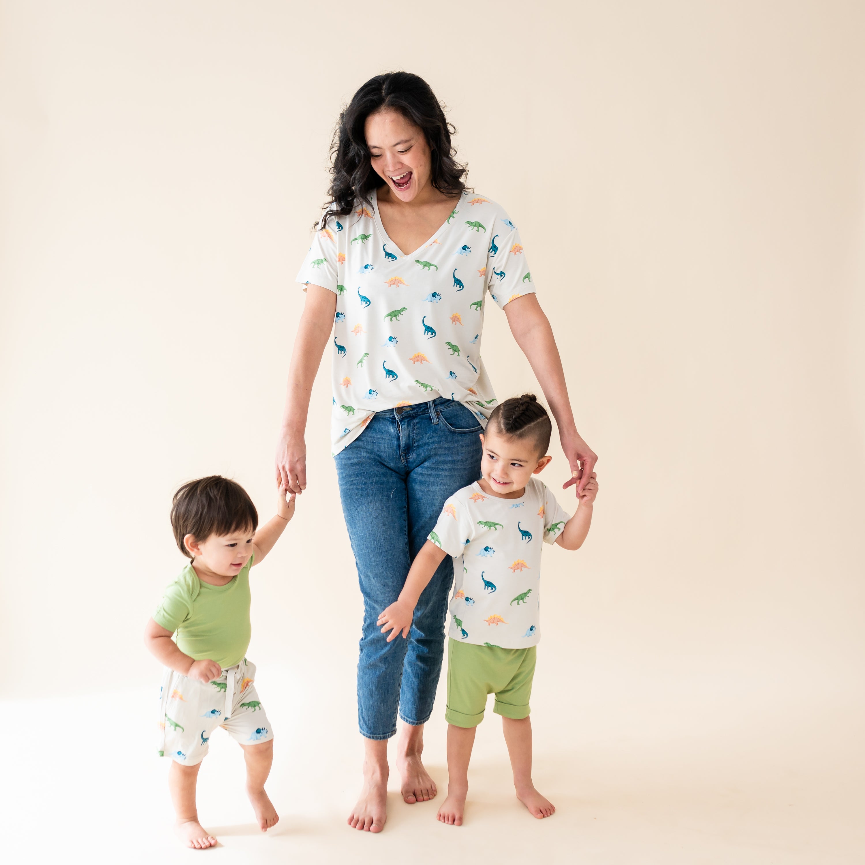 Family modeling the Ecru Roar collection featuring the women's relaxed fit v-neck, toddler drawstring shorts and toddler basic tee
