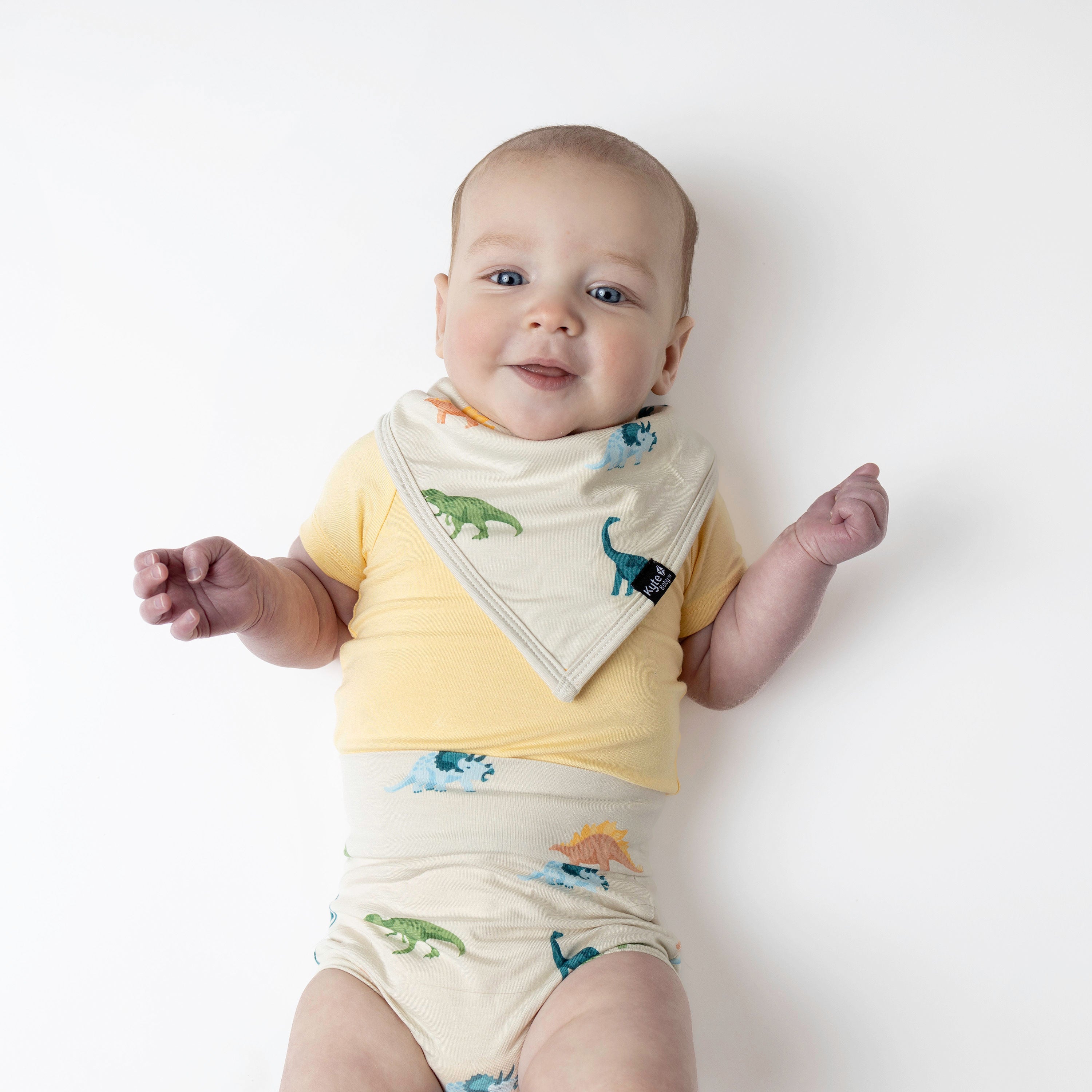 Baby wearing Bib in Ecru Roar and Bummies with Lilikoi bodysuit
